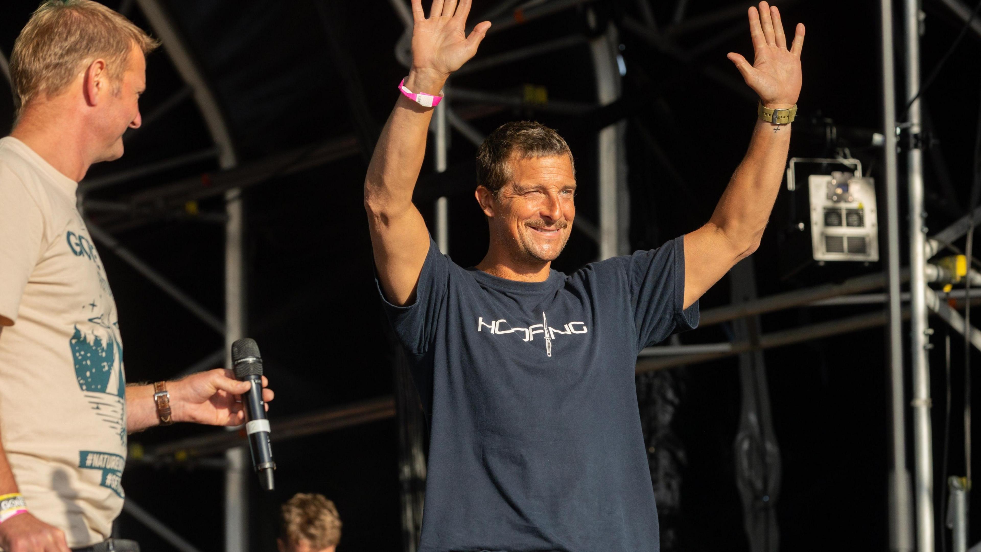 Bear Grylls greets the festival crowd