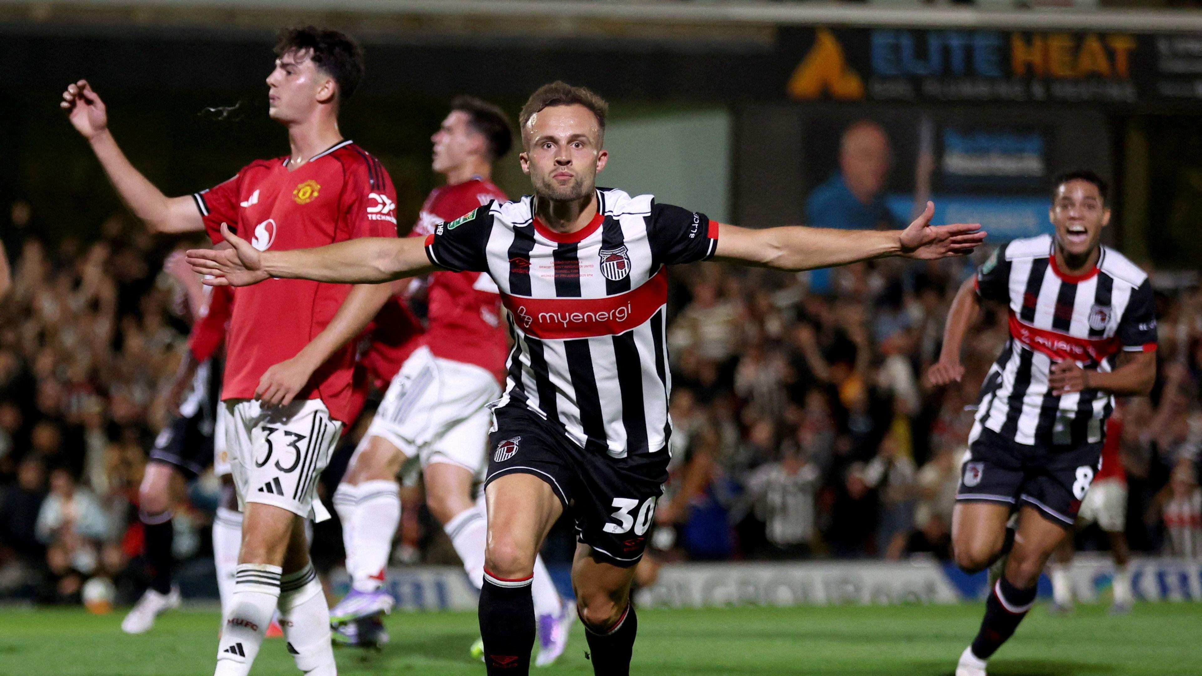 Grimsby Town's Charles Vernam celebrates scoring their first goal.