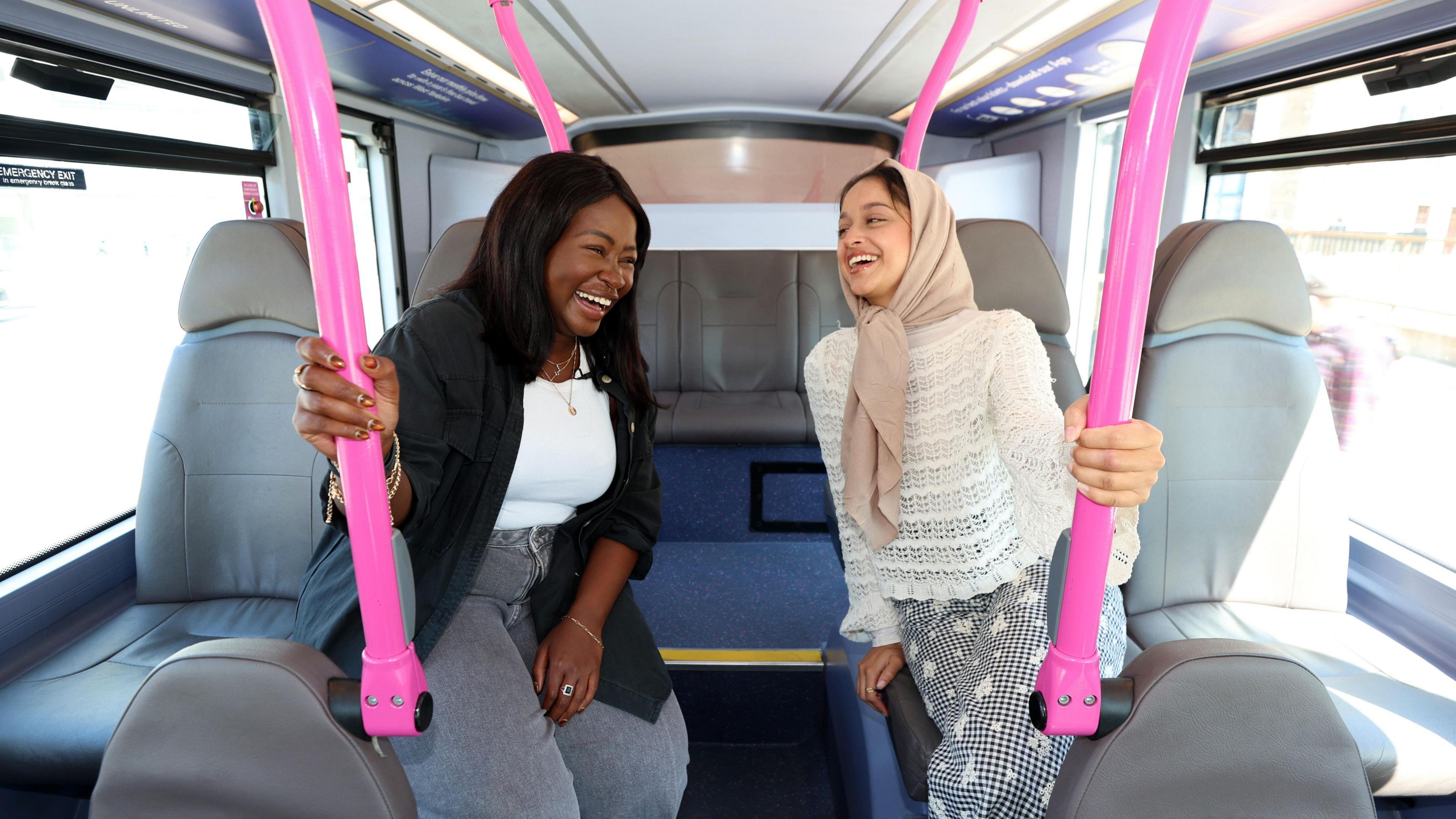 Two women aboard a bus