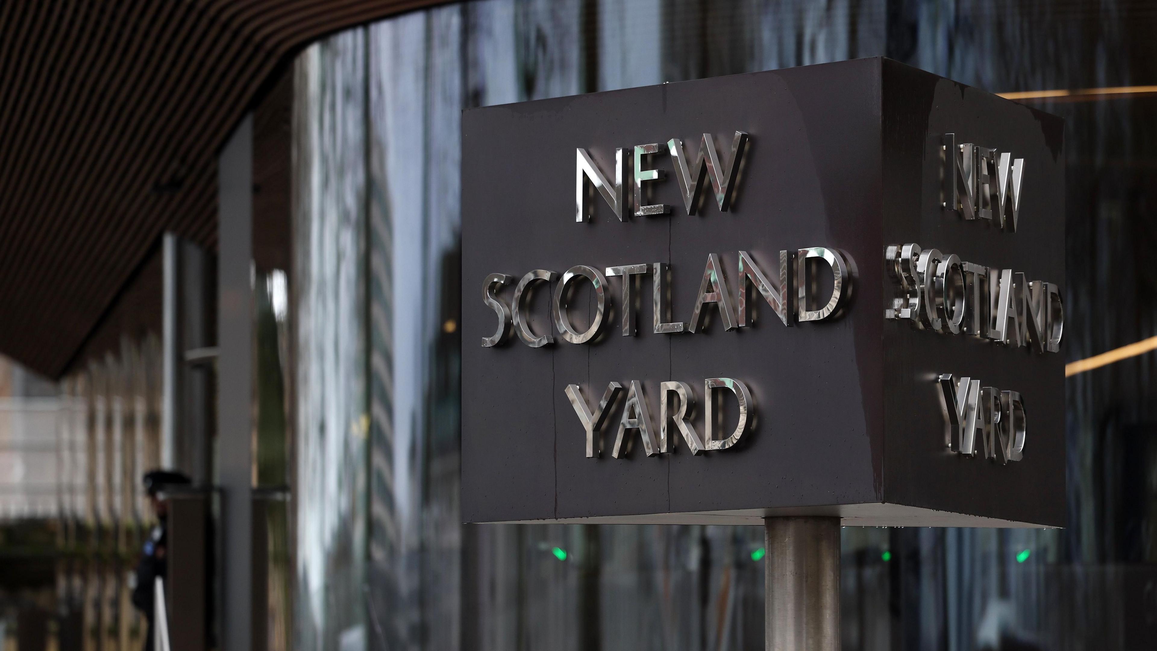 Revolving sign outside New Scotland Yard