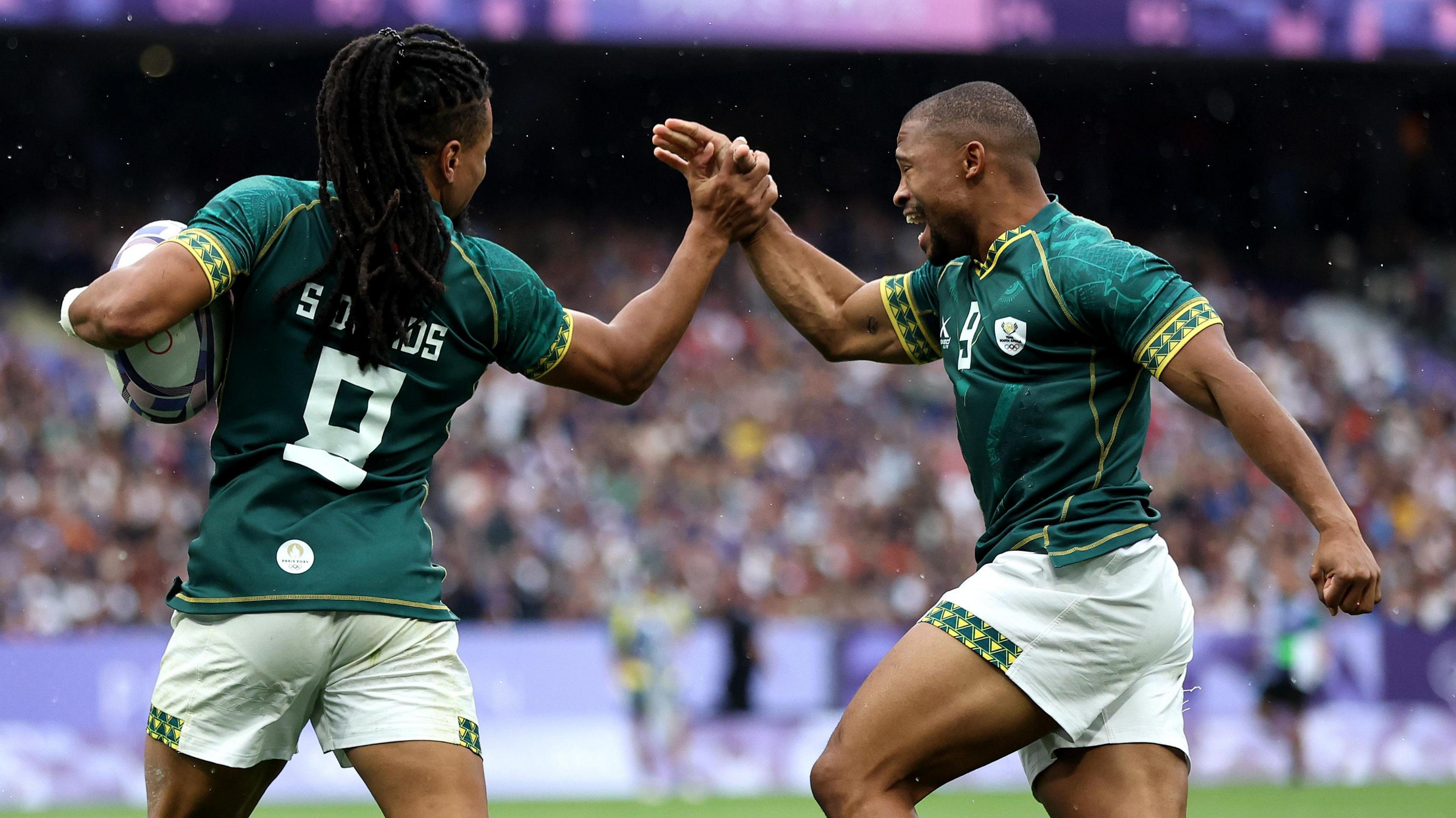 Selvyn Davids of Team South Africa celebrates with team-mate Shaun Williams