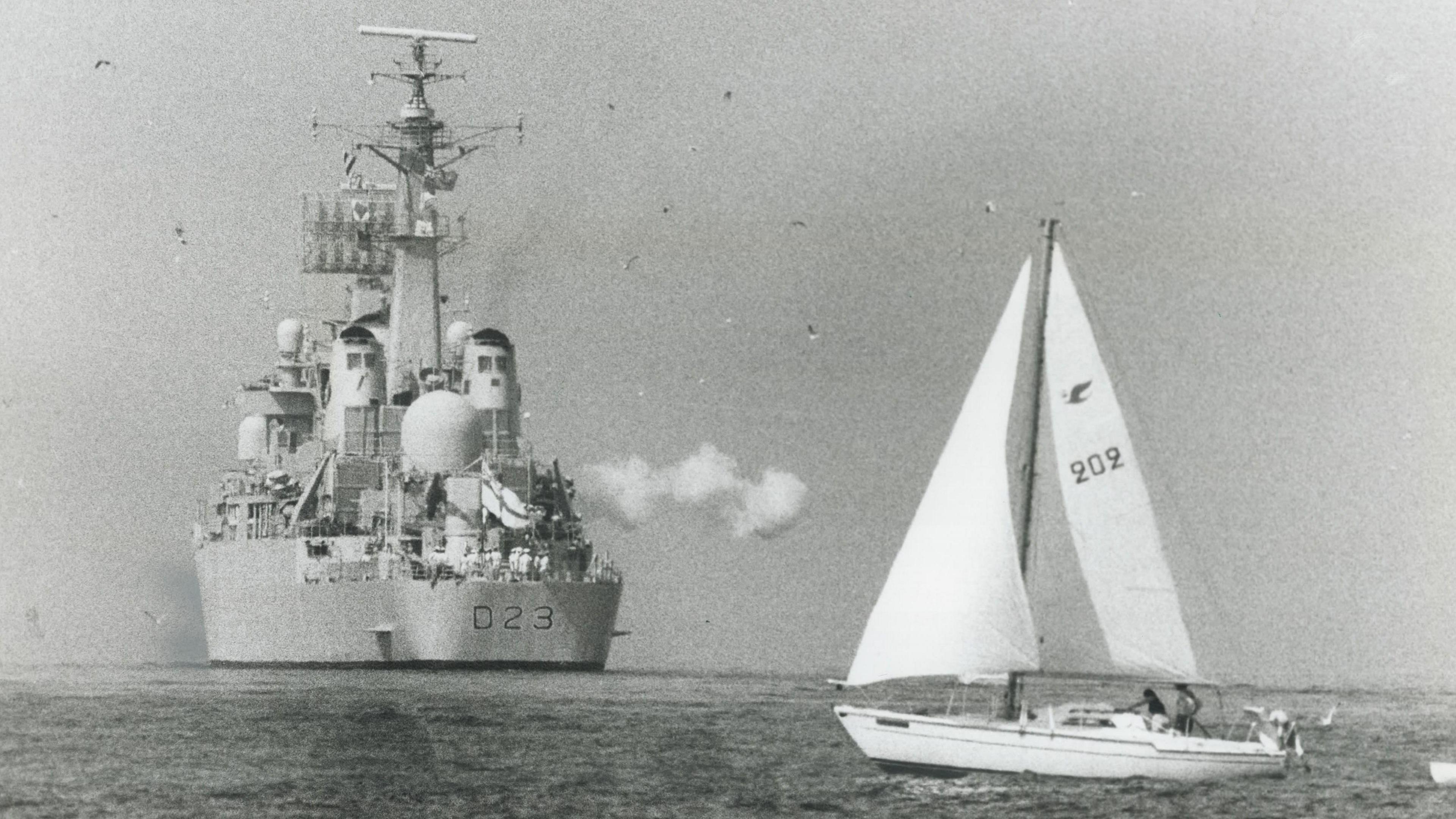 A cloud of smoke from the British guided missile destroyer HMS Bristol signifies the goodbye salute as the ship leaves the Western Gap.