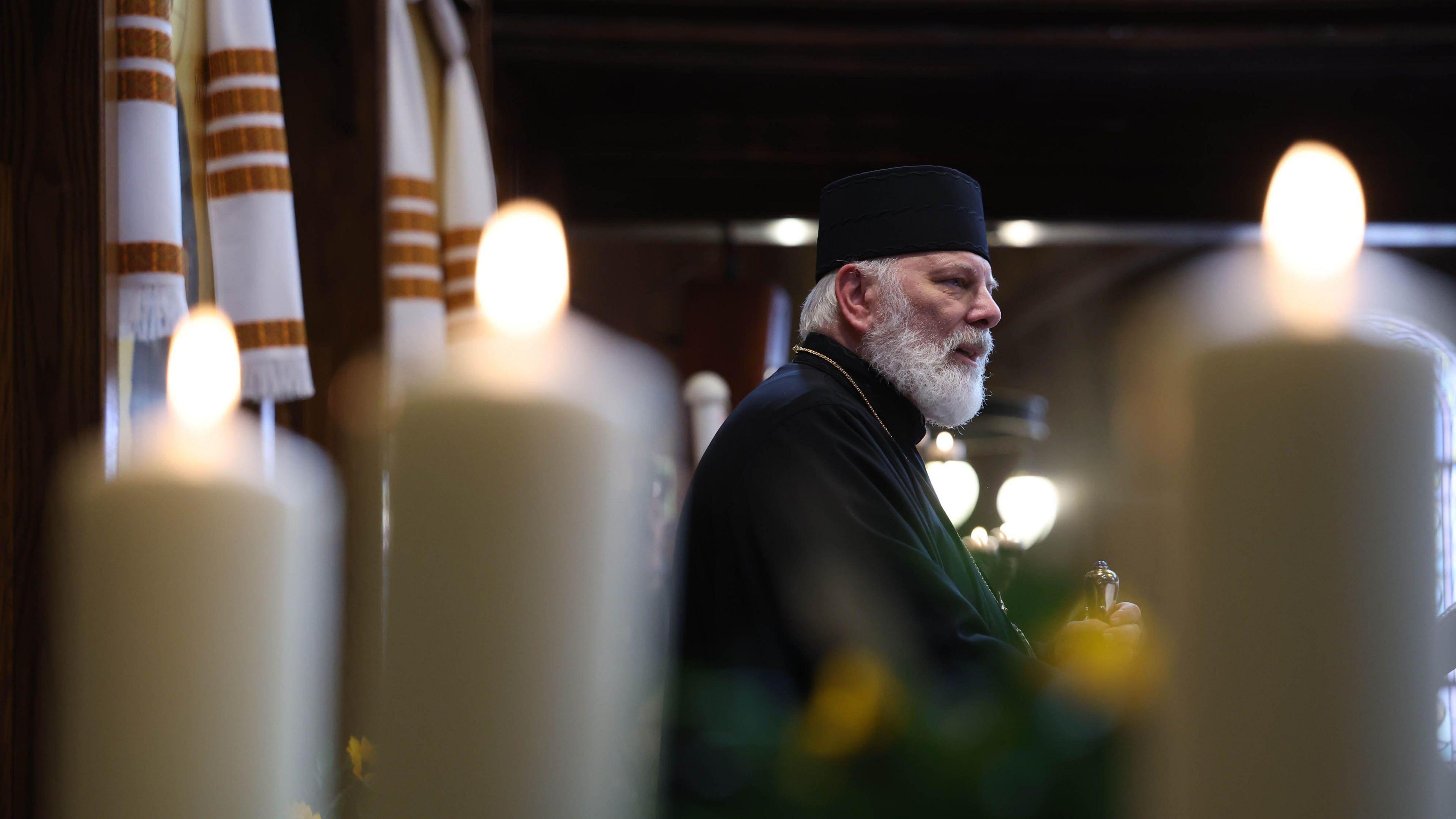 Bishop Kenneth Nowakowski speaks during an interfaith prayer service for peace in Ukraine at the Ukrainian Catholic Cathedral 