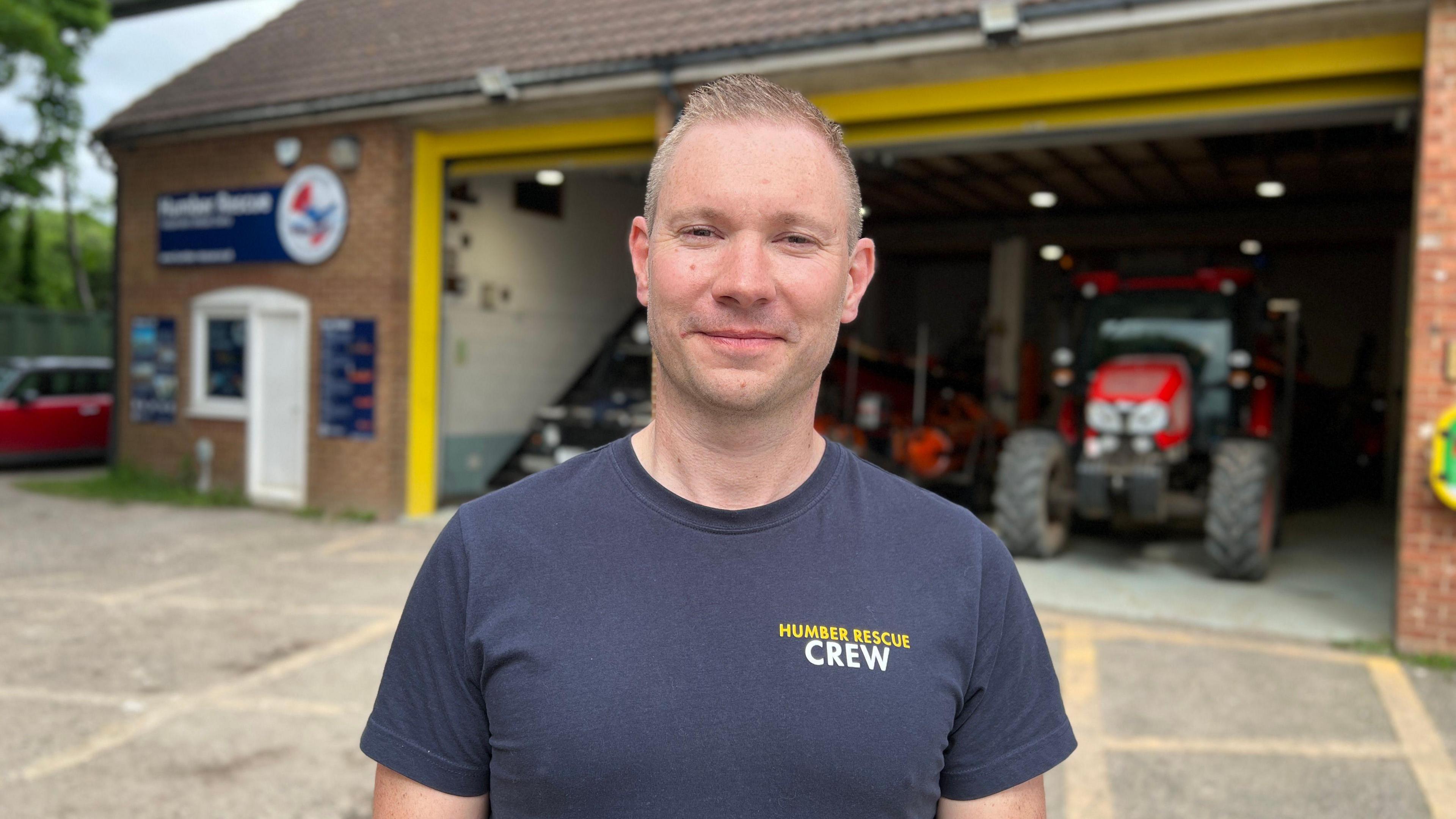 Ross Cooper from Humber Rescue standing in front of the lifeboat station