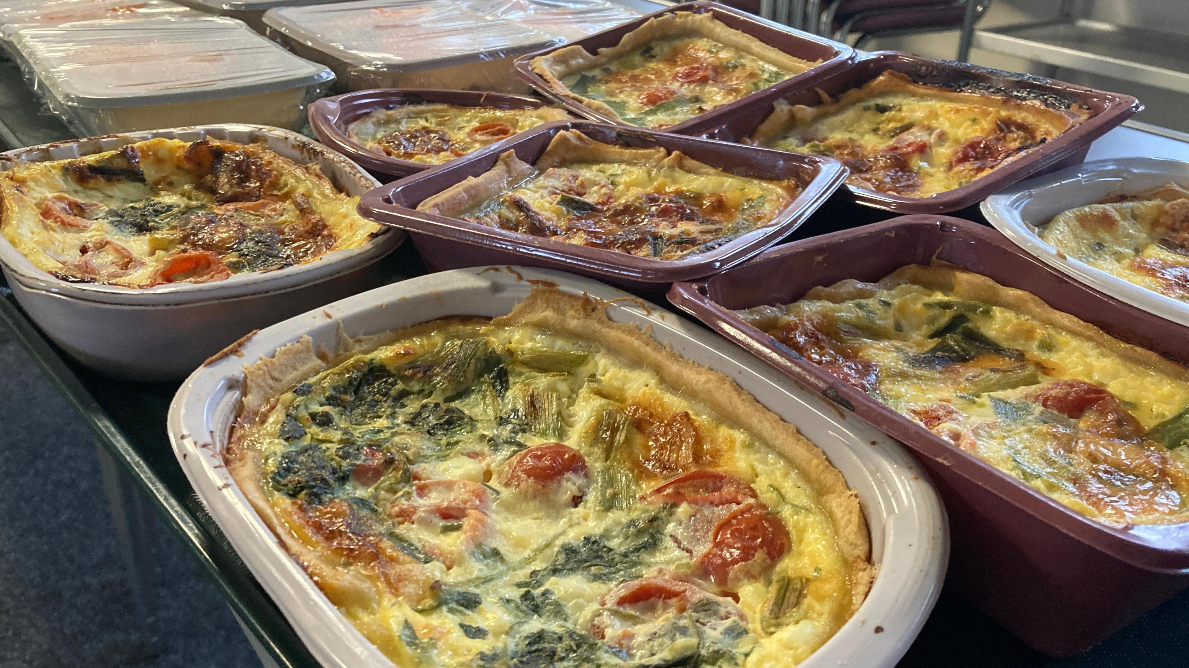 Trays full of vegetable quiches