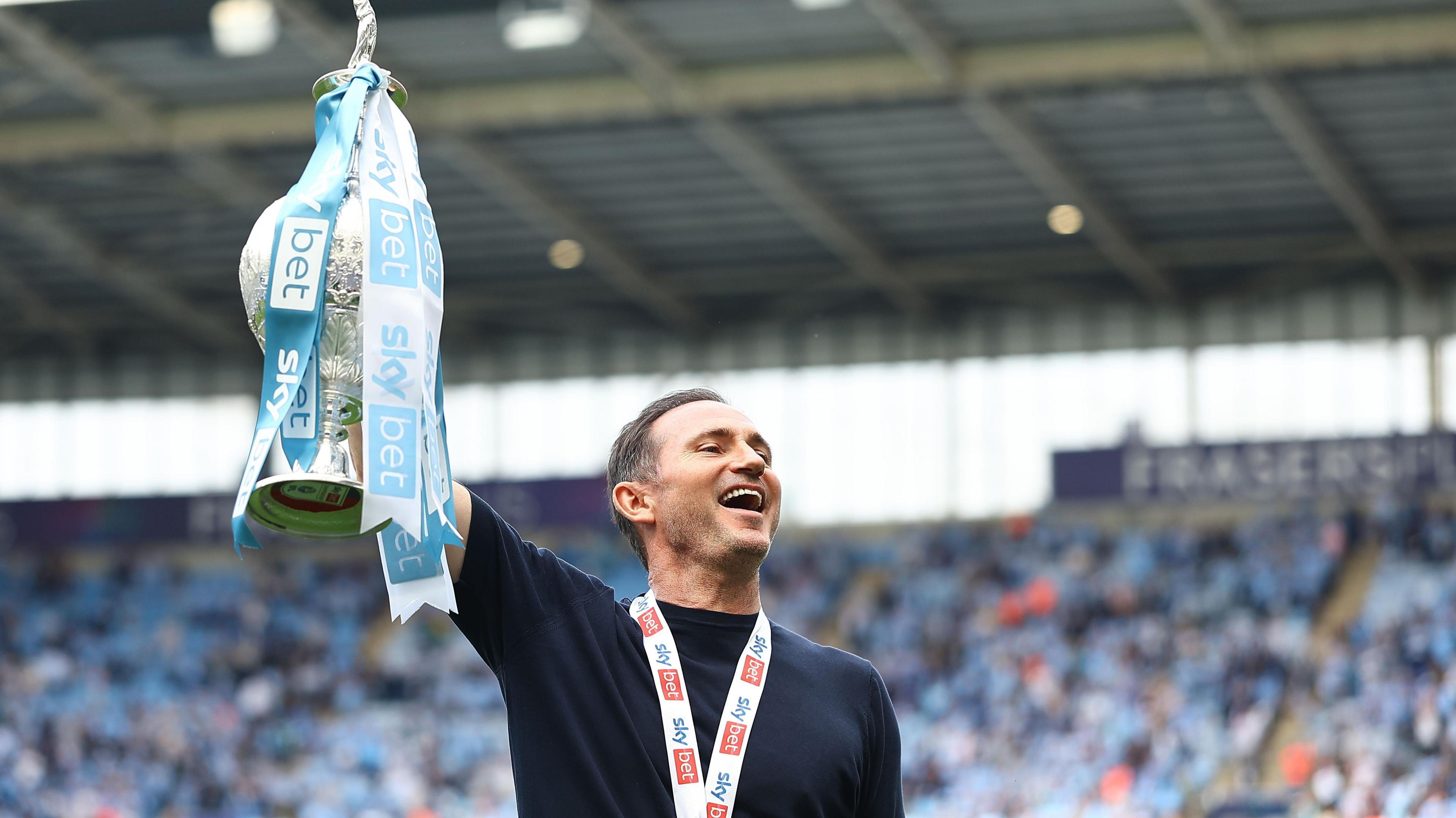 Frank Lampard celebrates in front of Coventry fans