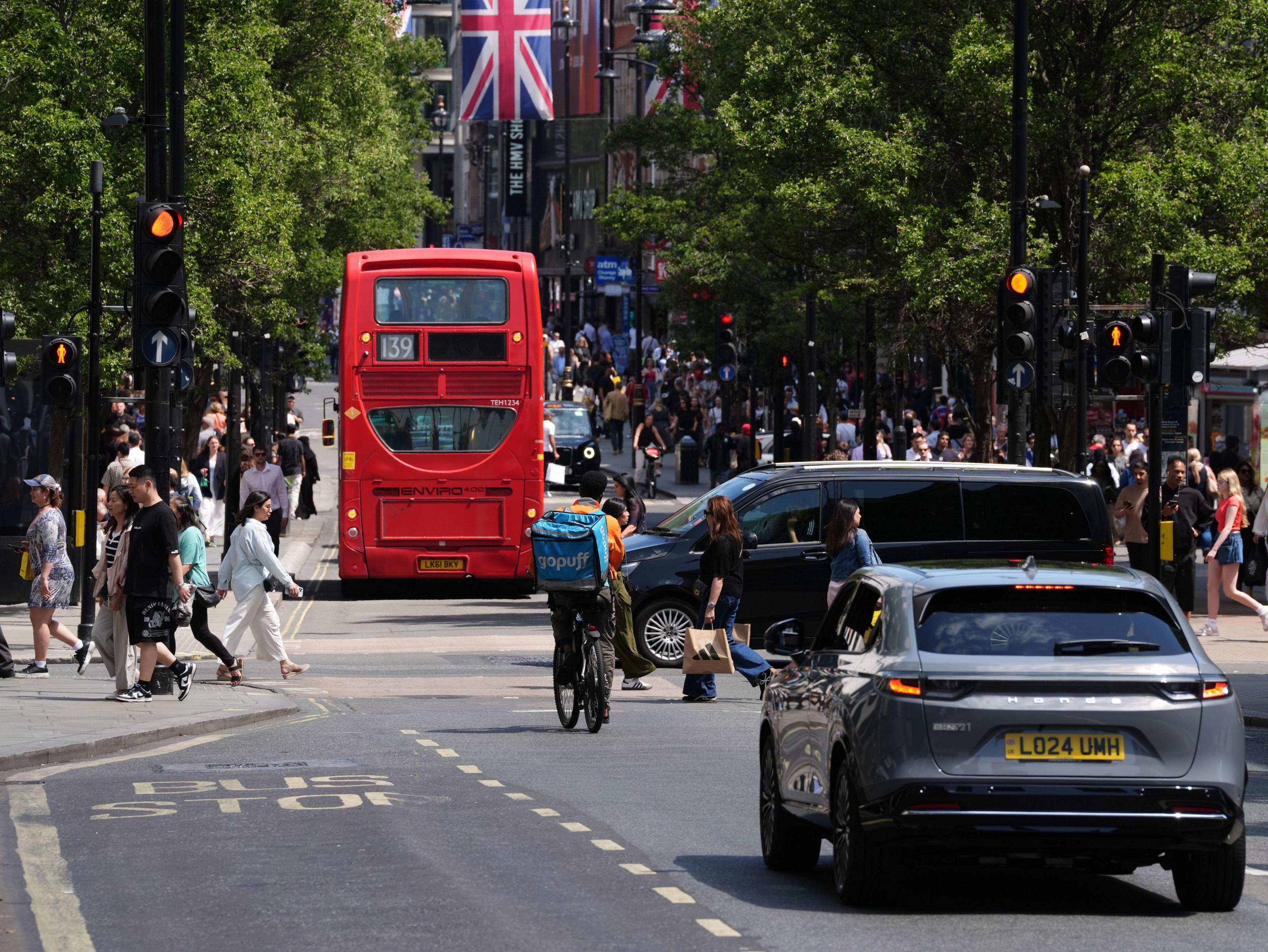 A view of Oxford Street in central London shows cars, bicycles and back of 139 bus