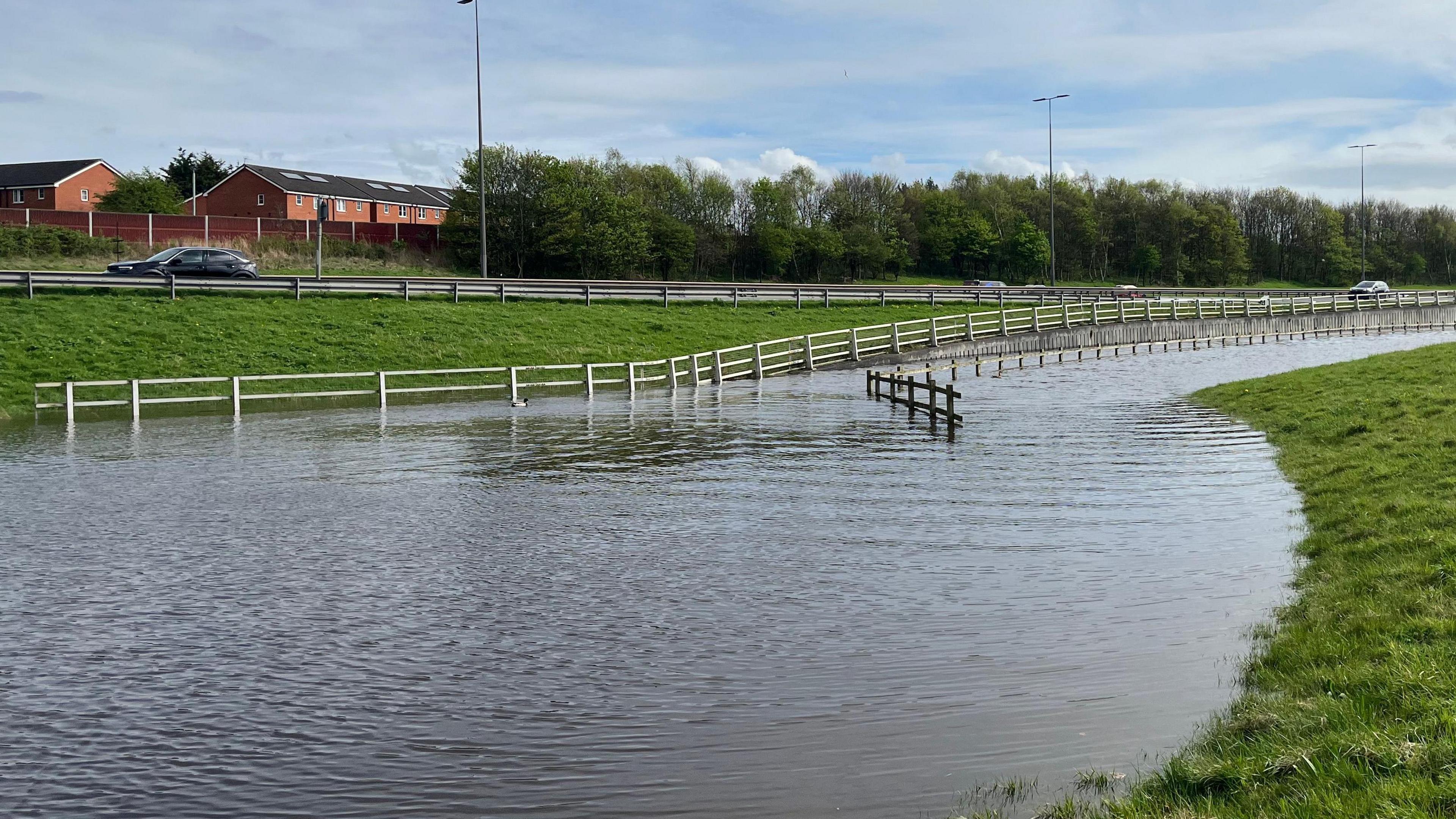 Fields under water close to a road