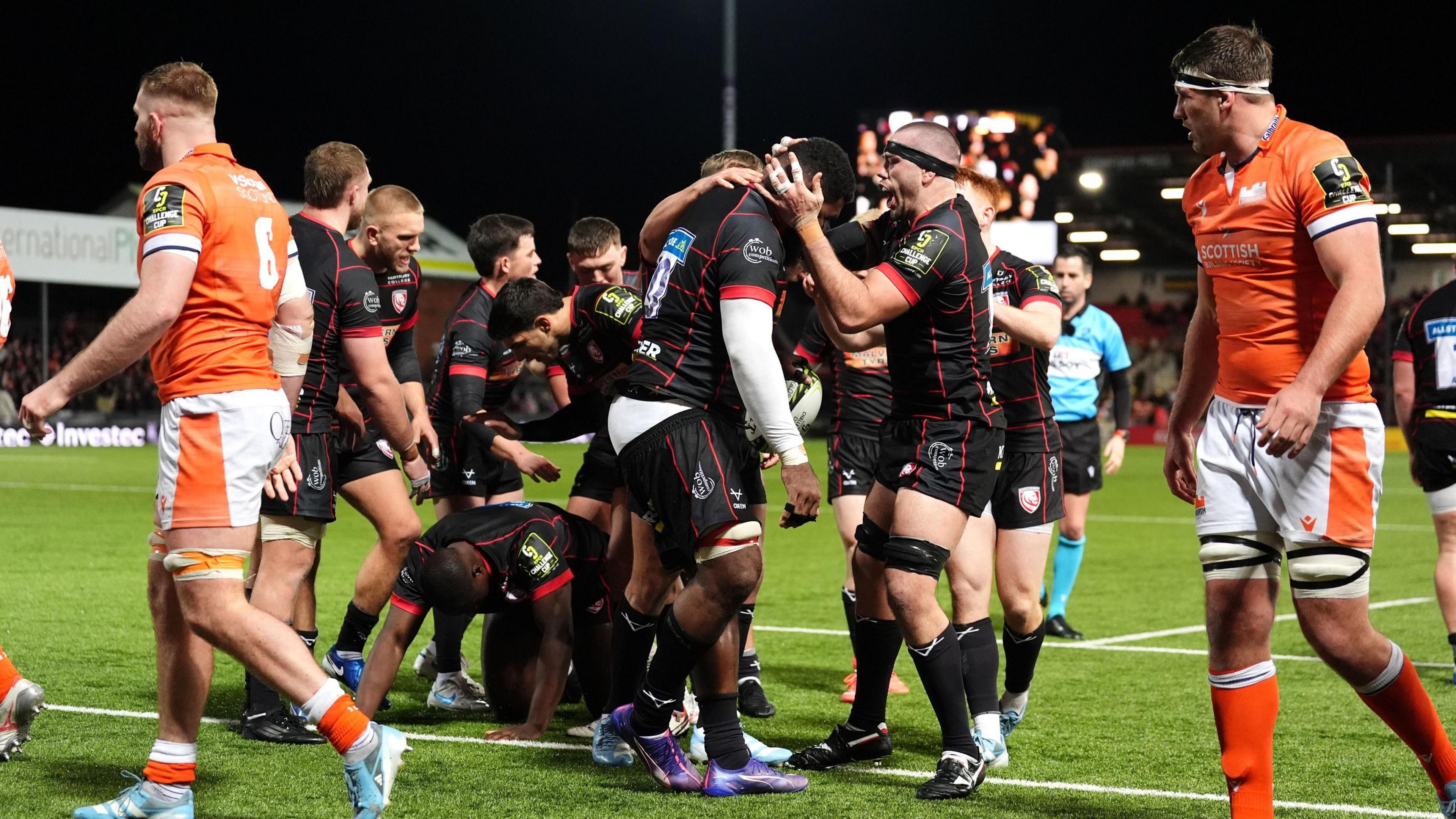 Lewis Ludlow holds Albert Tuisue's head in celebration after he scores a try