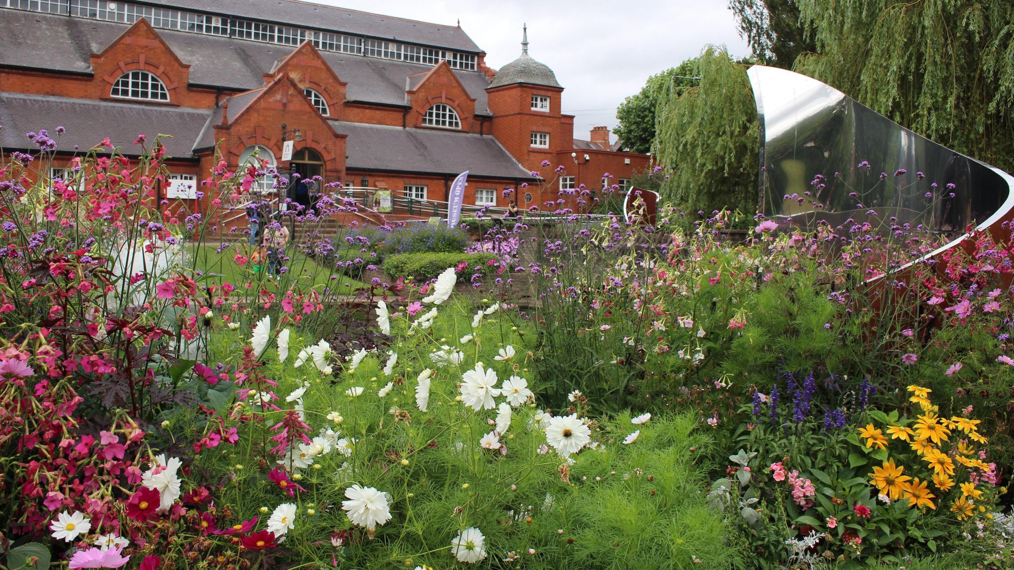 Flowers in front of Charnwood Museum in Queen's Park