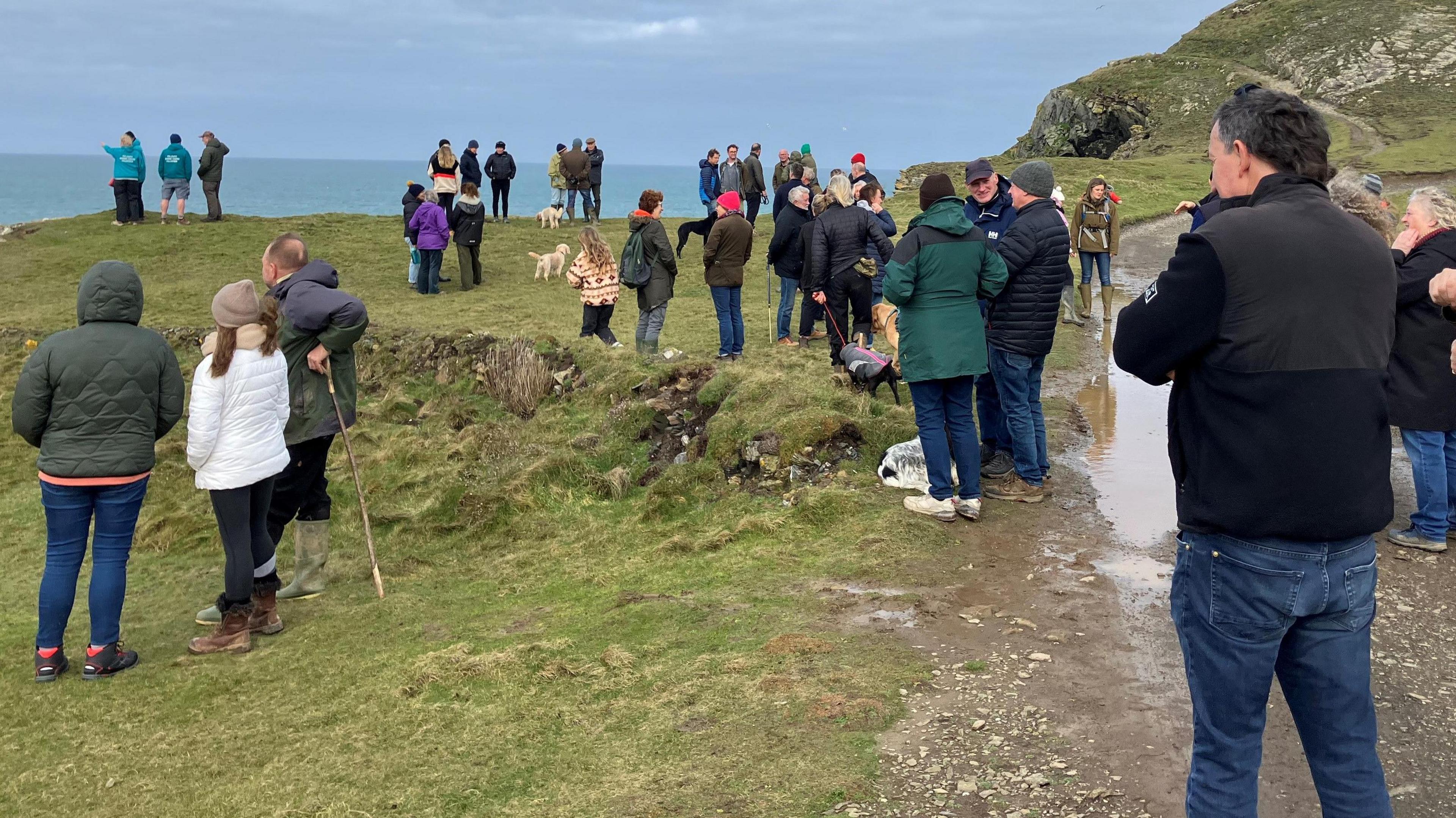 People on the cliffs at Port Quin