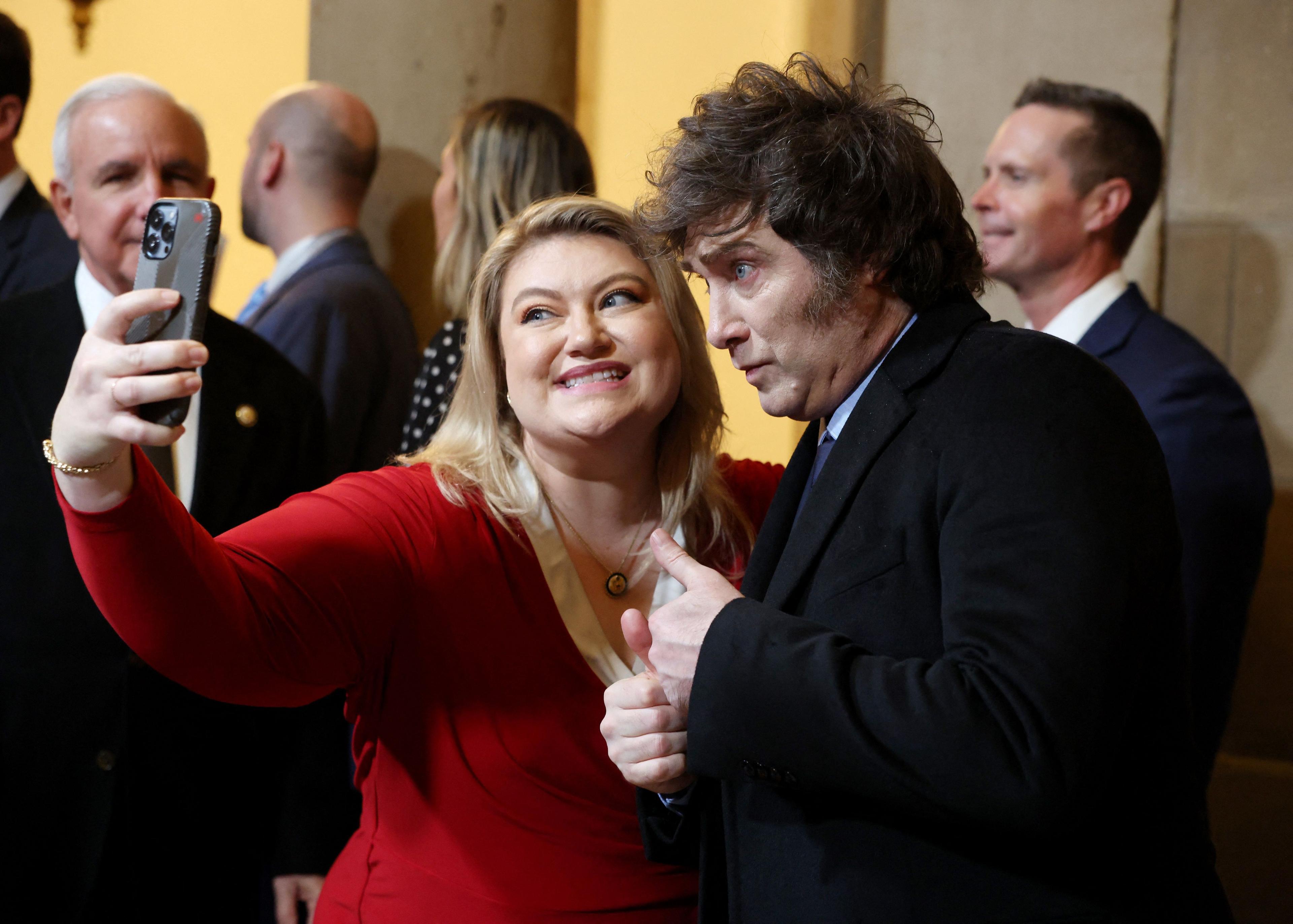 US Rep Kat Cammack and Argentina's President Javier Milei pose for a selfie 