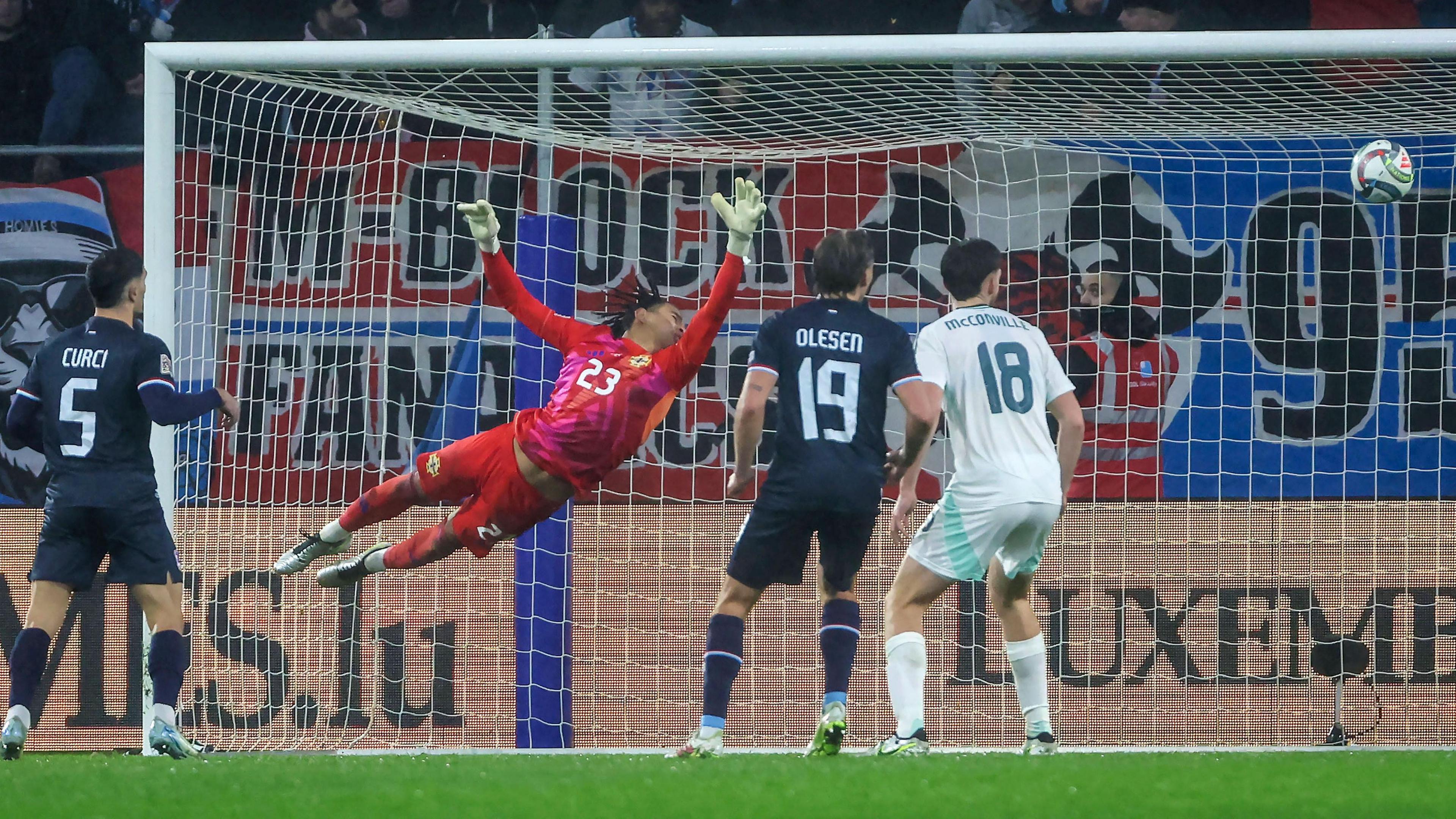 Pierce Charles dives to his left