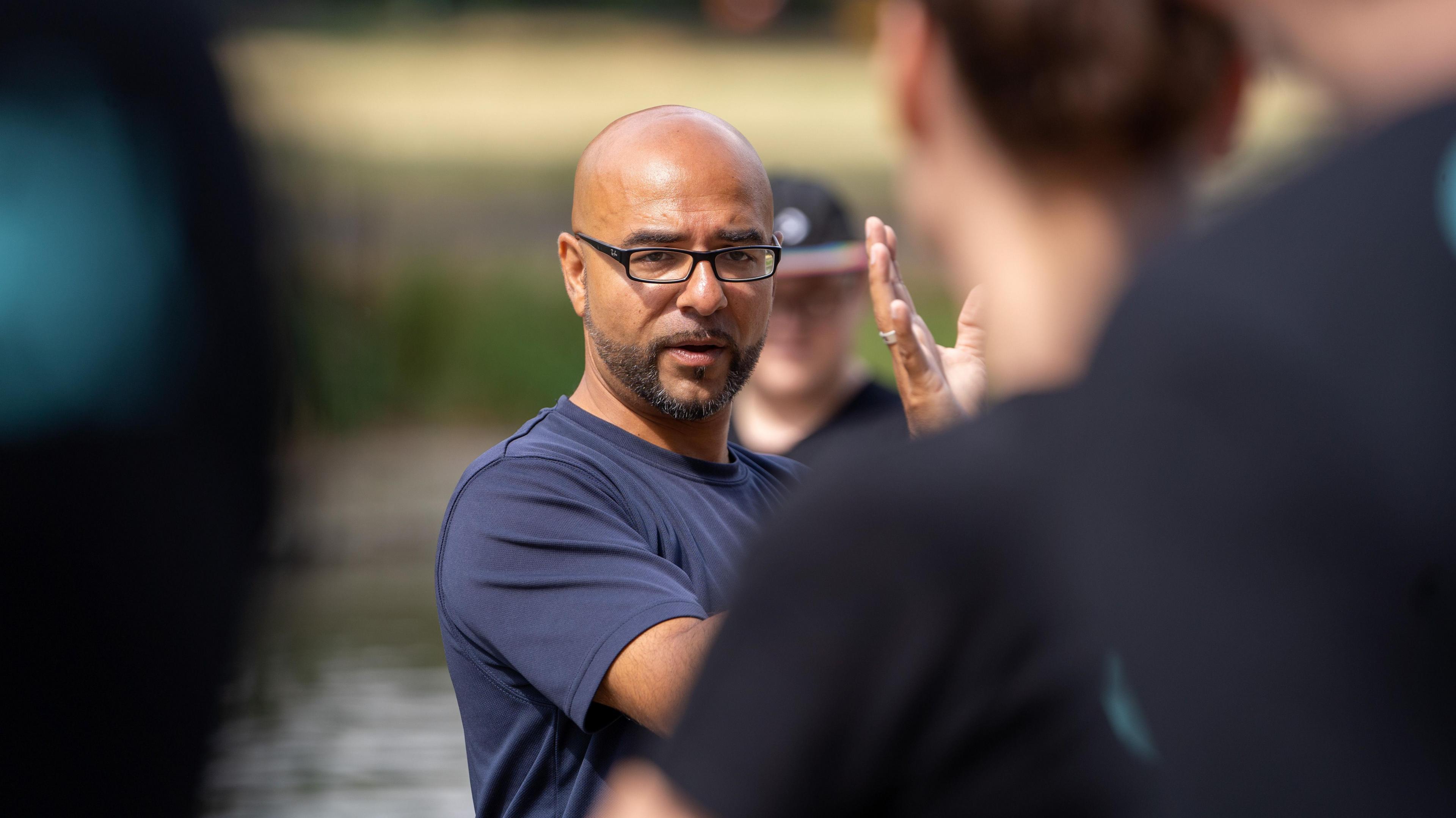 Omar Terywell in a blue T-shirt looking at the camera