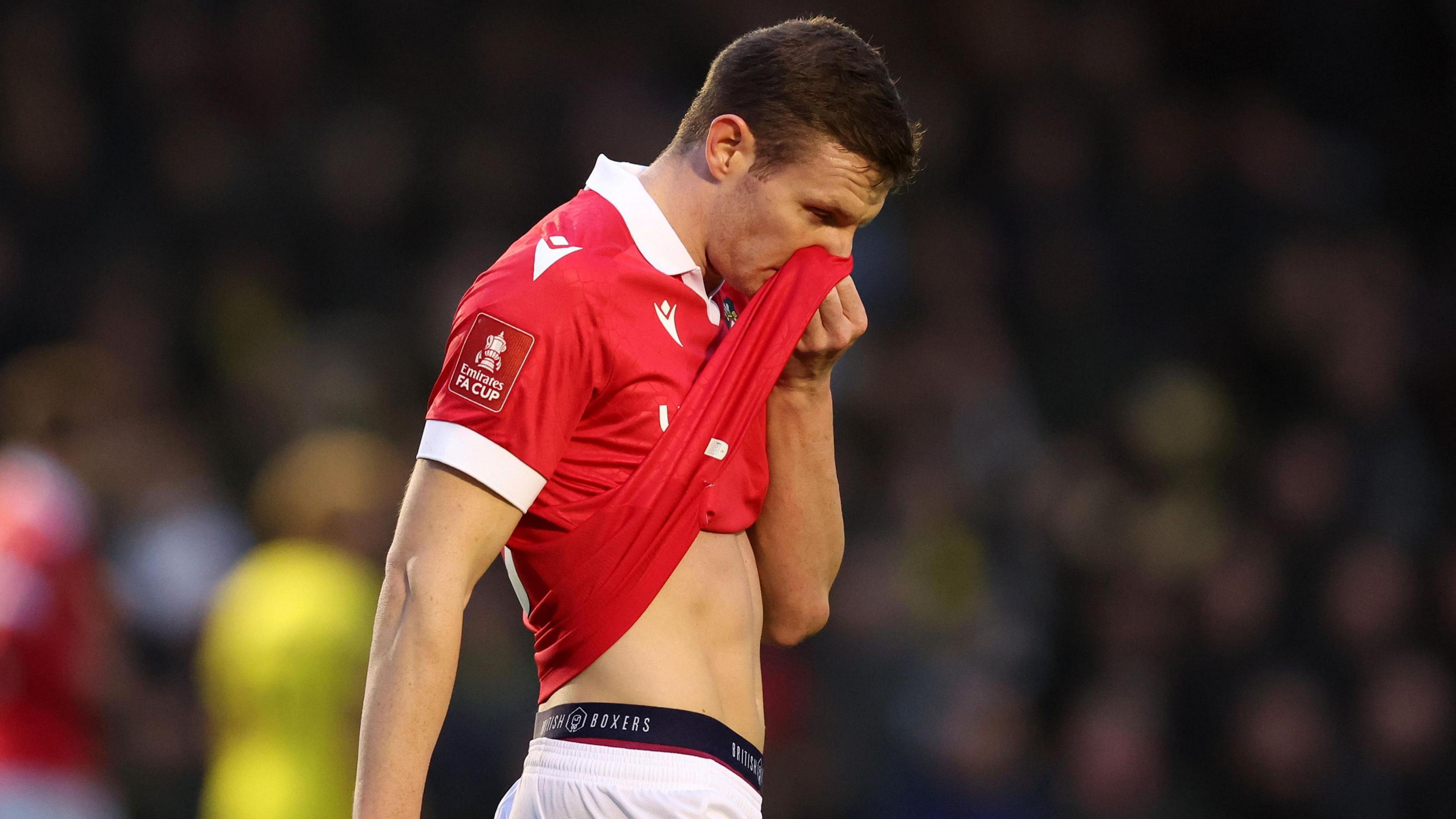 Wrexham striker Paul Mullin looks dejected after Harrogate goal