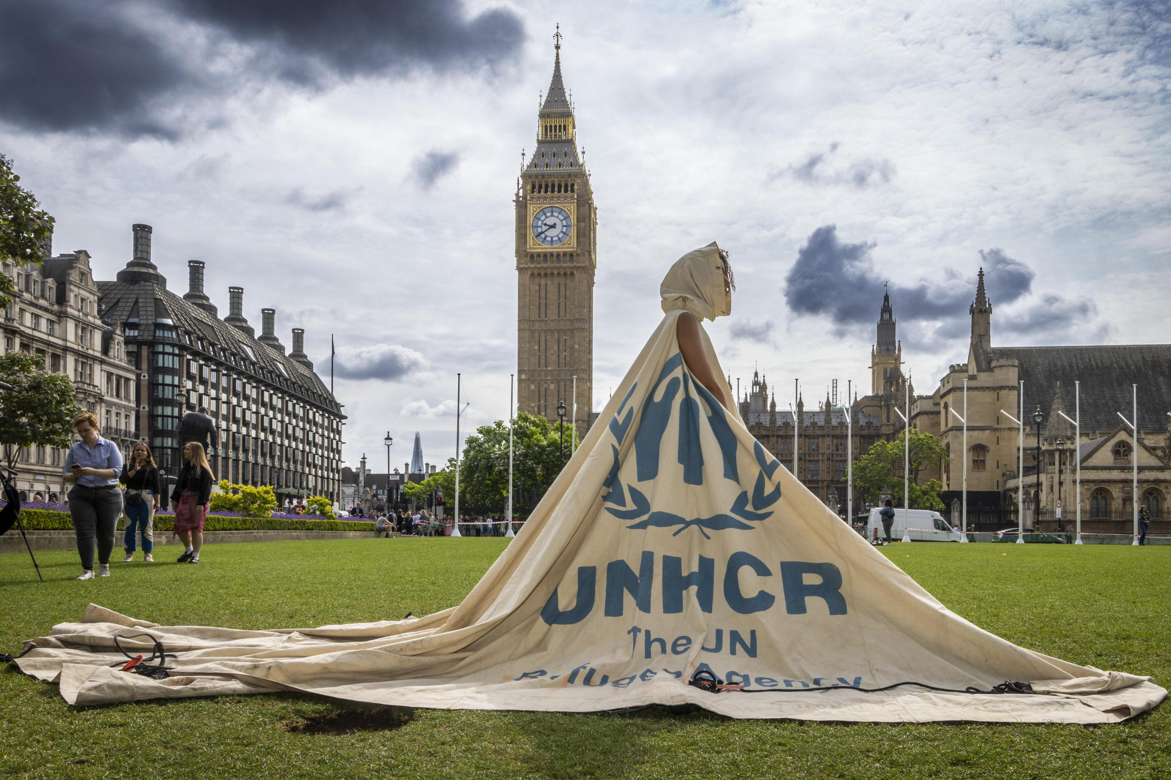 Woman wearing Helen Storey’s Dress for our Time, made from  a decommissioned refugee tent donated by the UNHCR