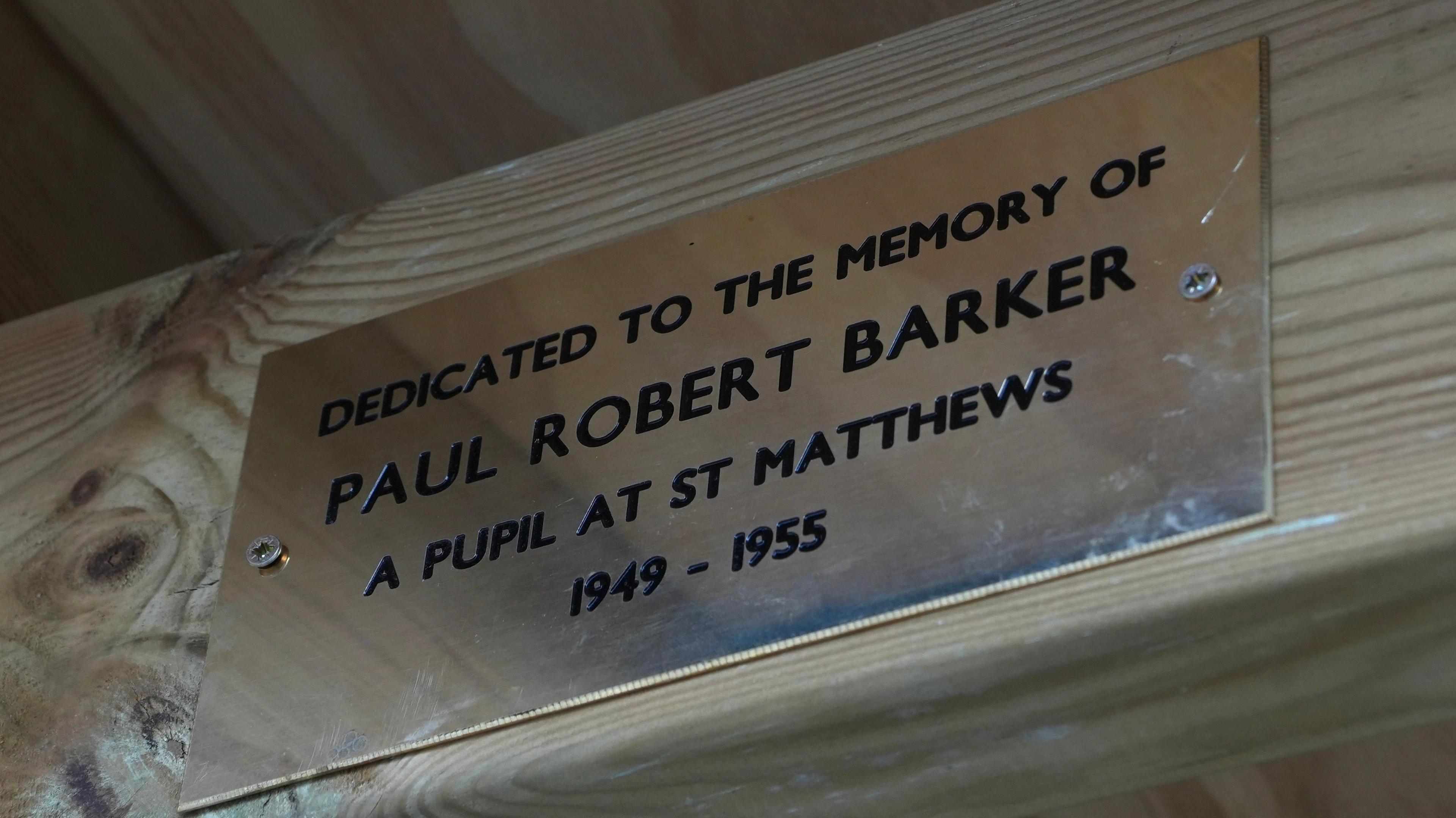 A memorial plaque that reads: Dedicated to the memory of Paul Robert Barker. A pupil at St Matthews 1949-1955. 