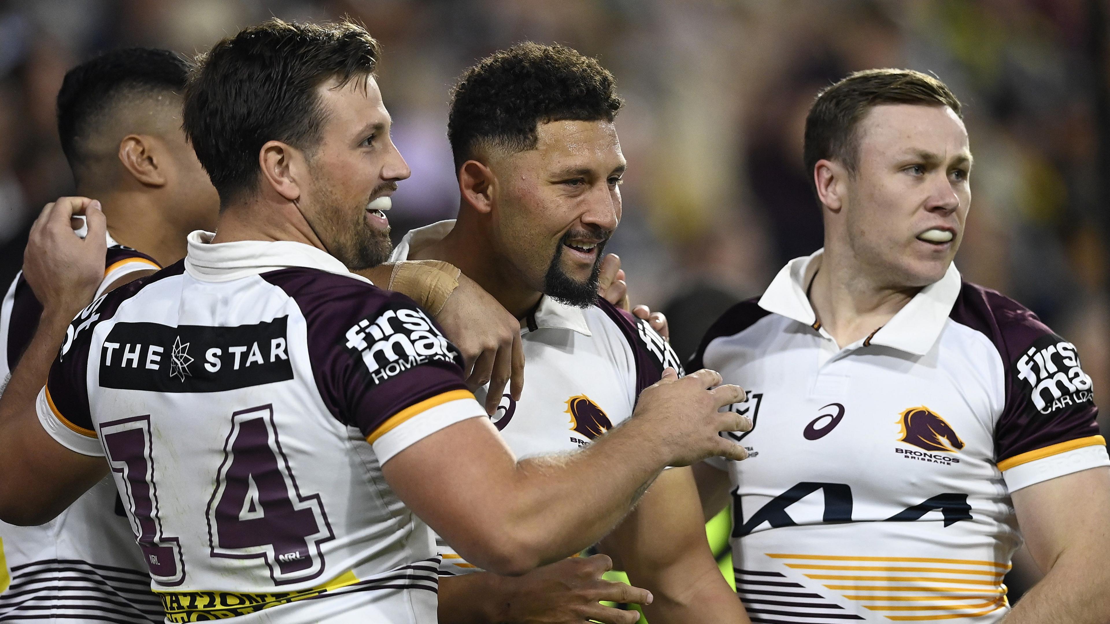Gehamat Shibasaki celebrates with three Brisbane Broncos team-mates