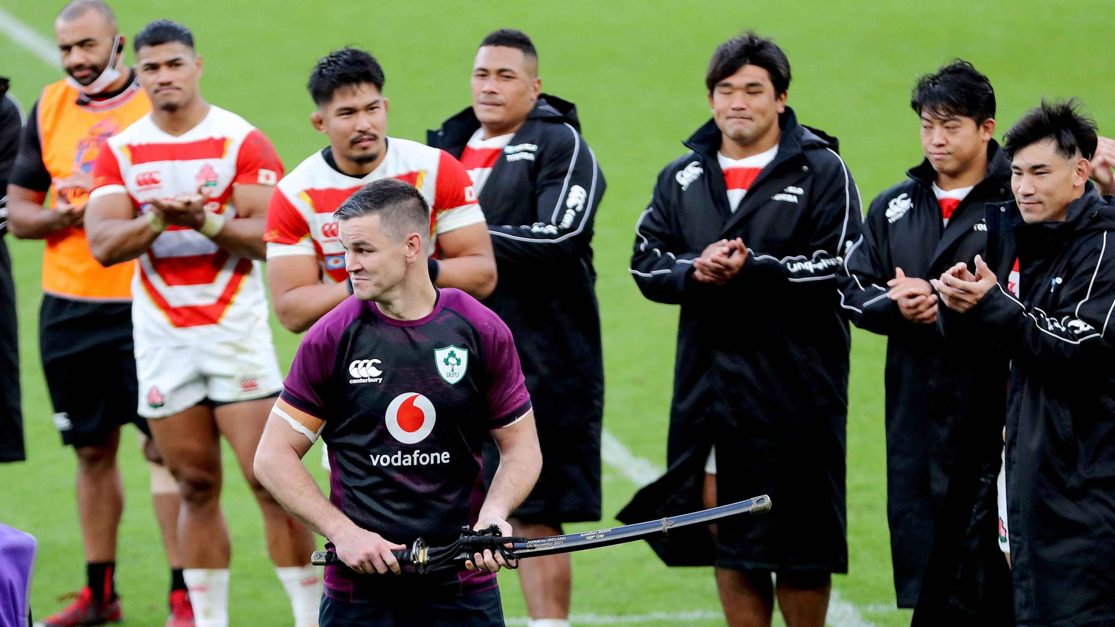 Johnny Sexton is presented a Samurai sword after his 100th cap