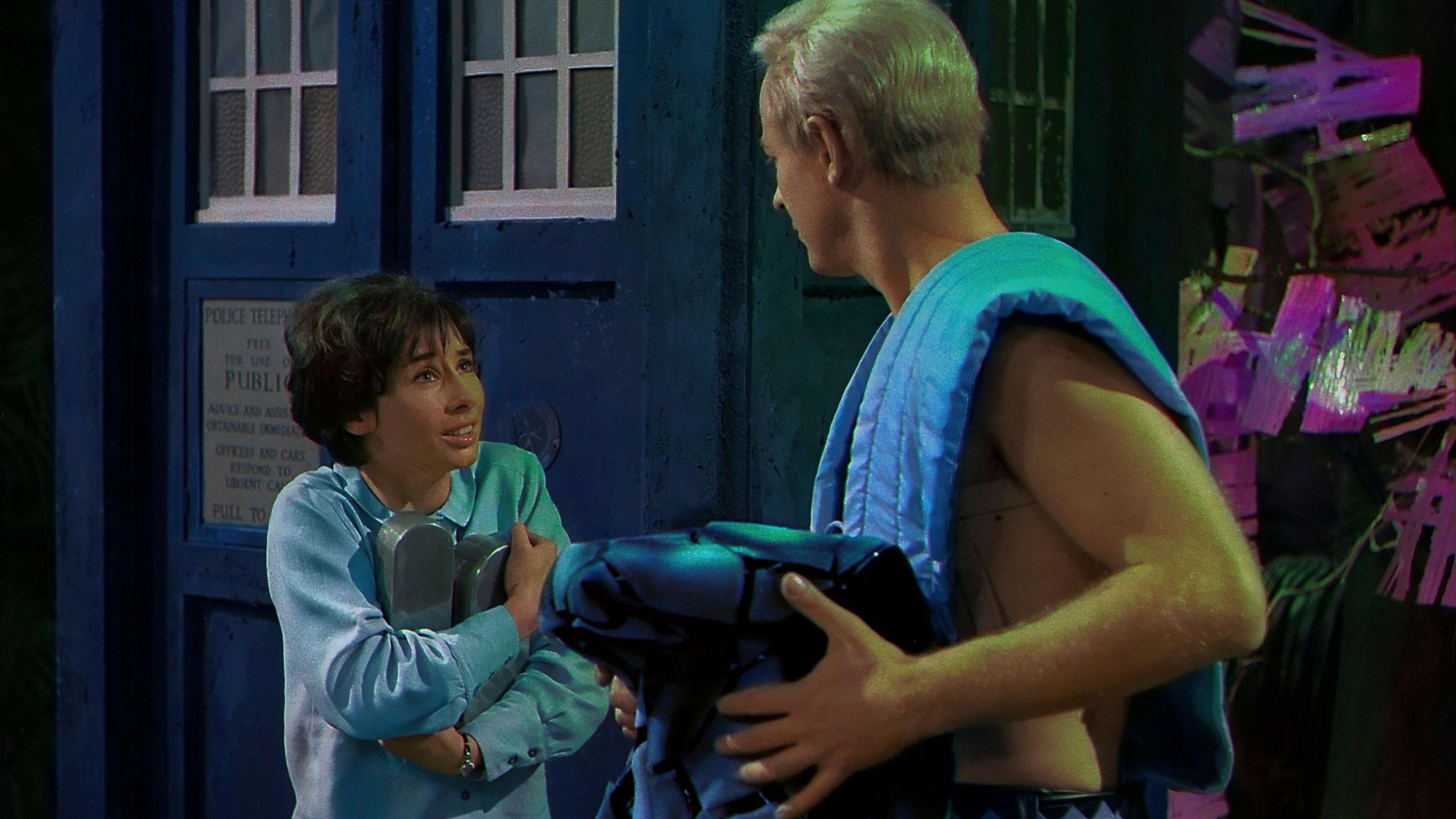 Carole Ann Ford as Susan standing outside the Tardis and talking to another character.