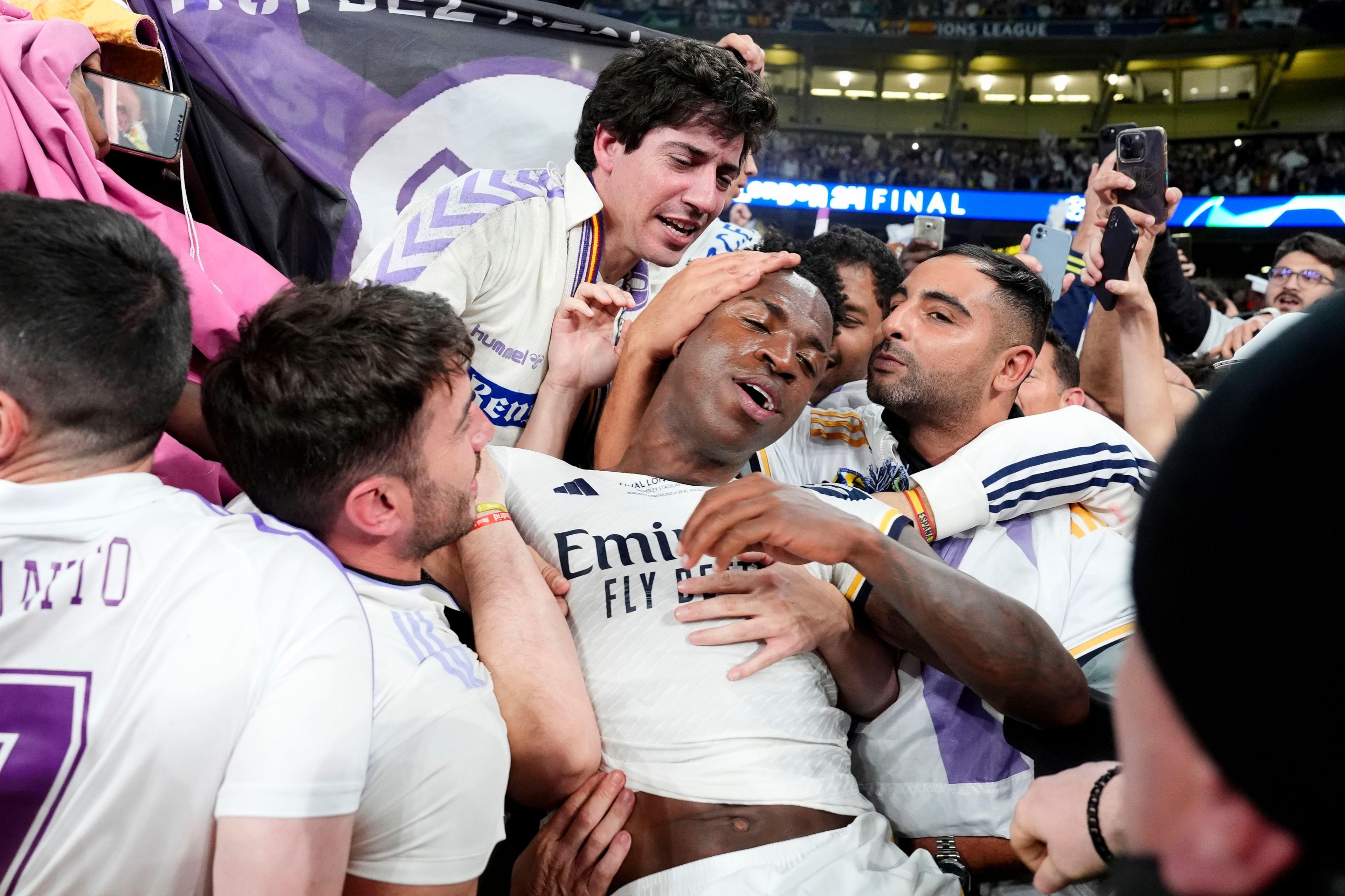 Real Madrid's Vinicius Junior celebrates with fans