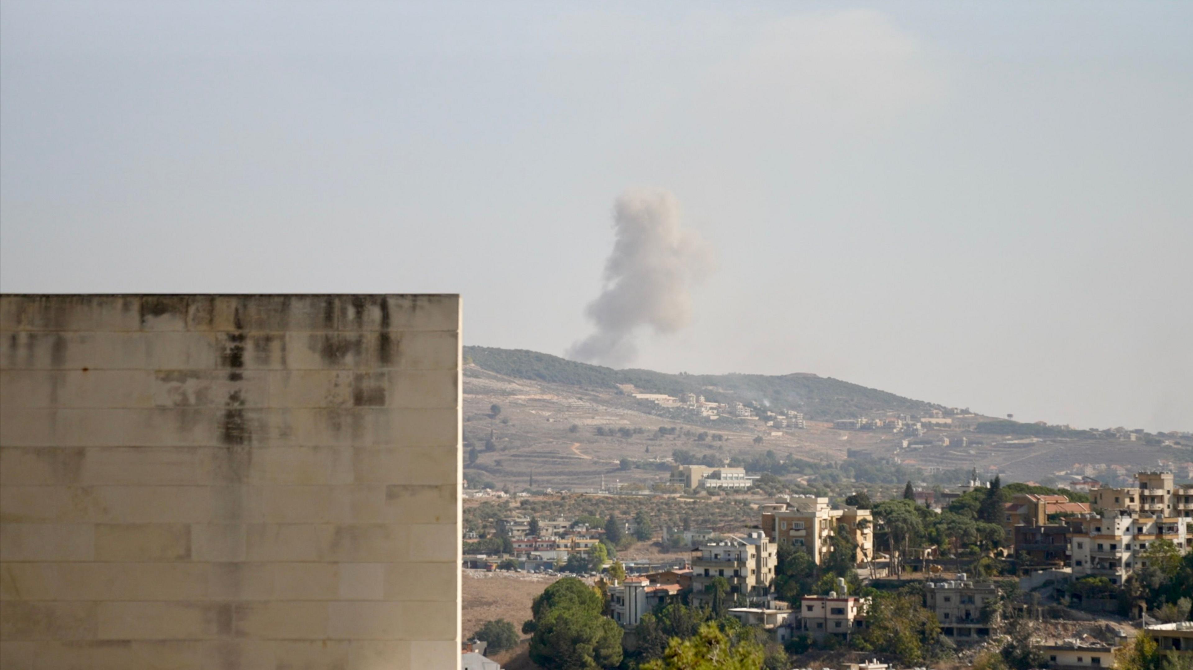 From the hospital, smoke is visible rising over hills from the village of Arab Salim