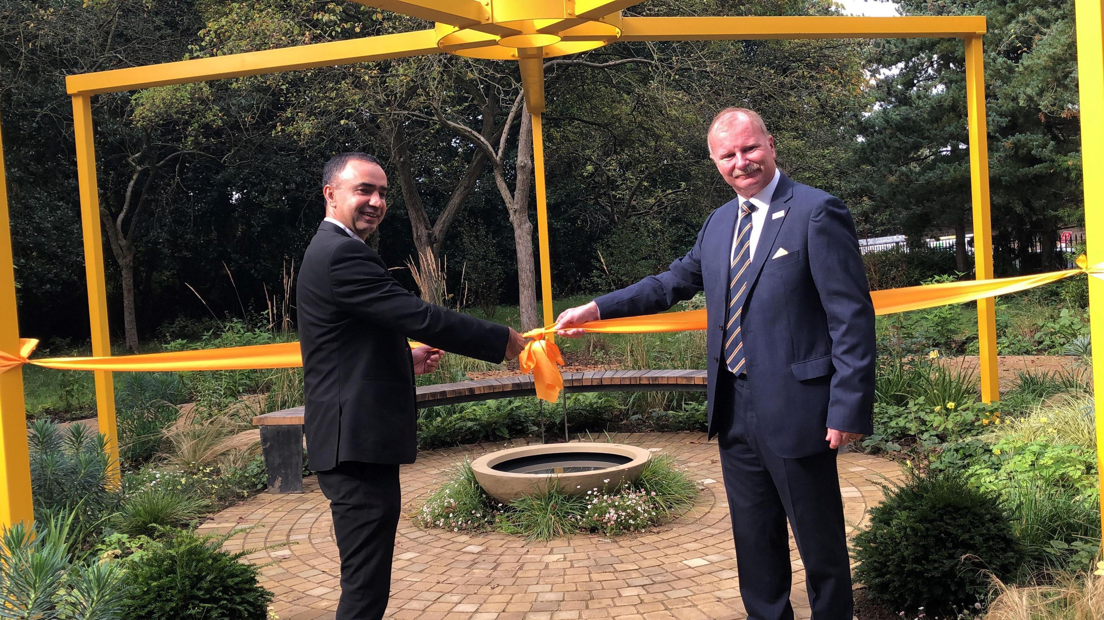 Councillor Mohammed Rafique and Mike Harrop, chairman, Yorkshire Air Ambulance