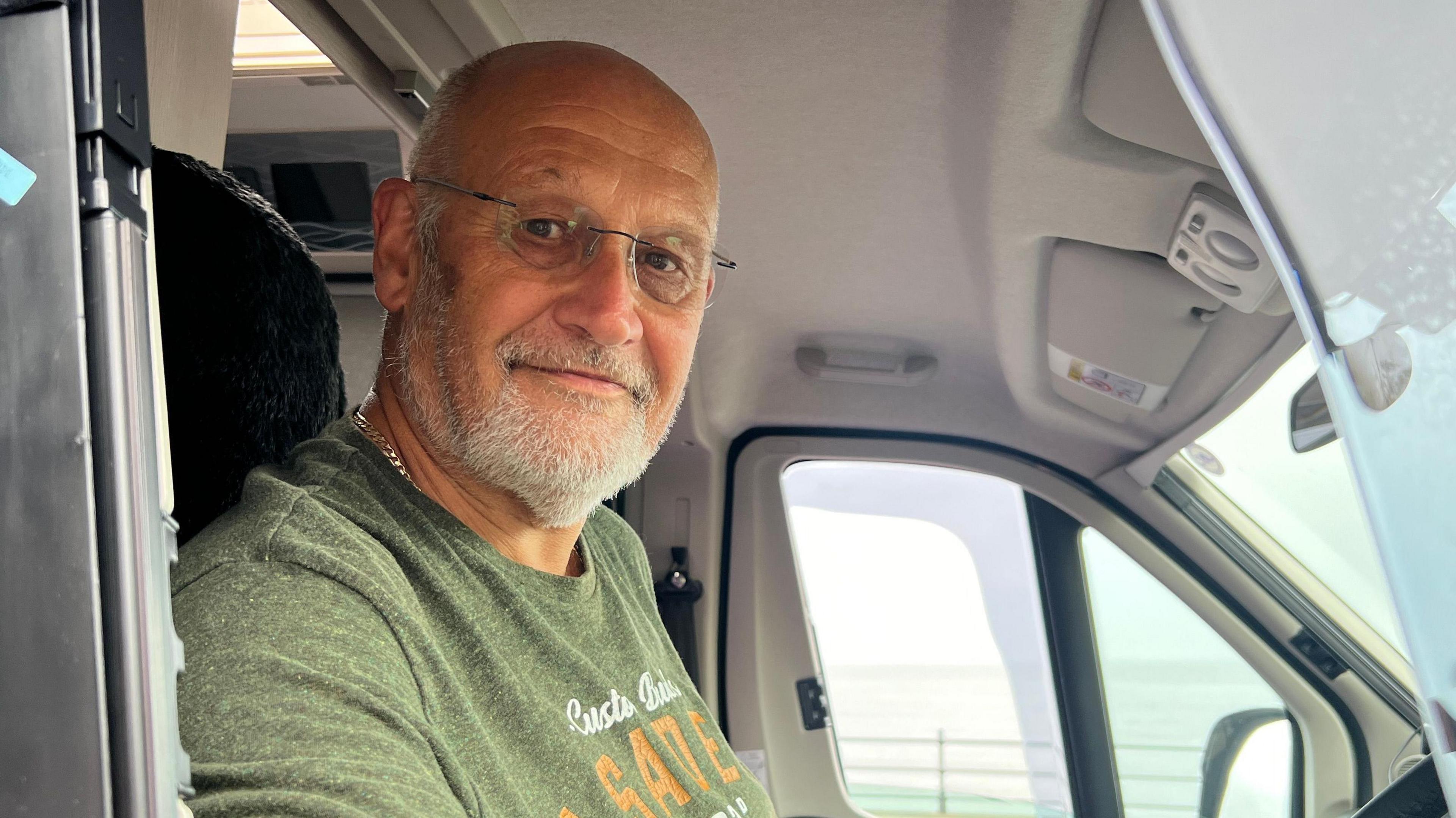 Brian Hallet in the cab of his motorhome