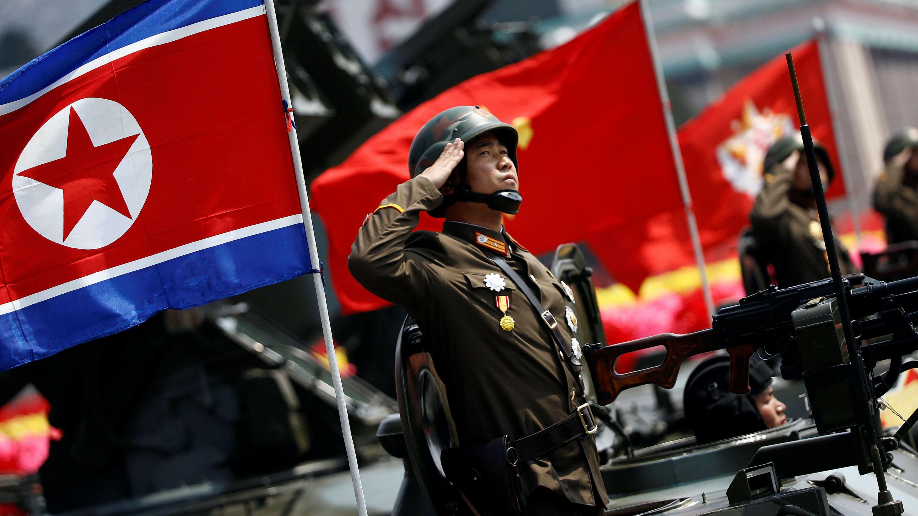 A Korean People"s Army (KPA) soldier salutes during a parade for the "Day of the Sun" festival on Kim Il Sung Square in Pyongyang