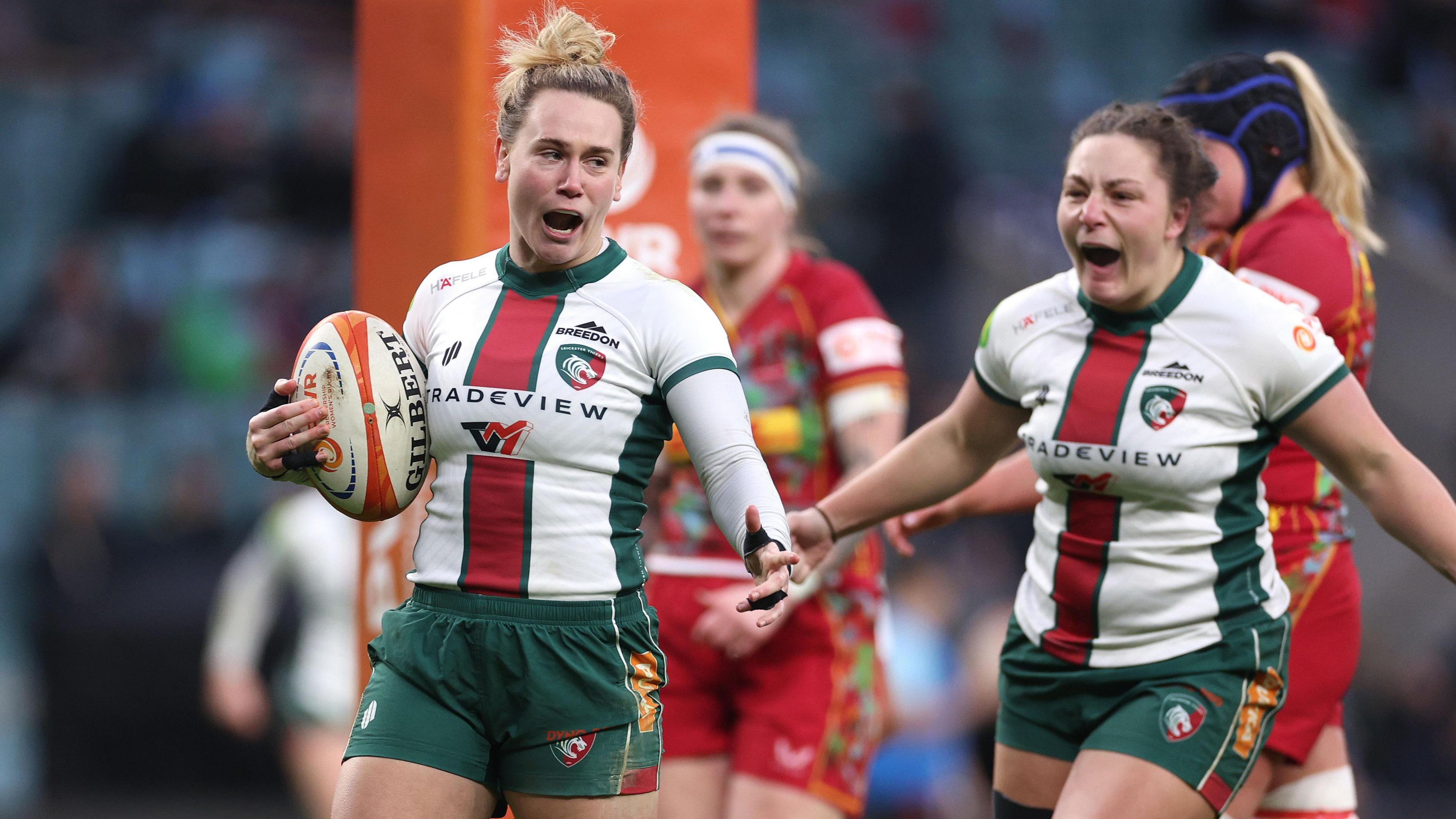 Meg Jones celebrates scoring a try for Leicester