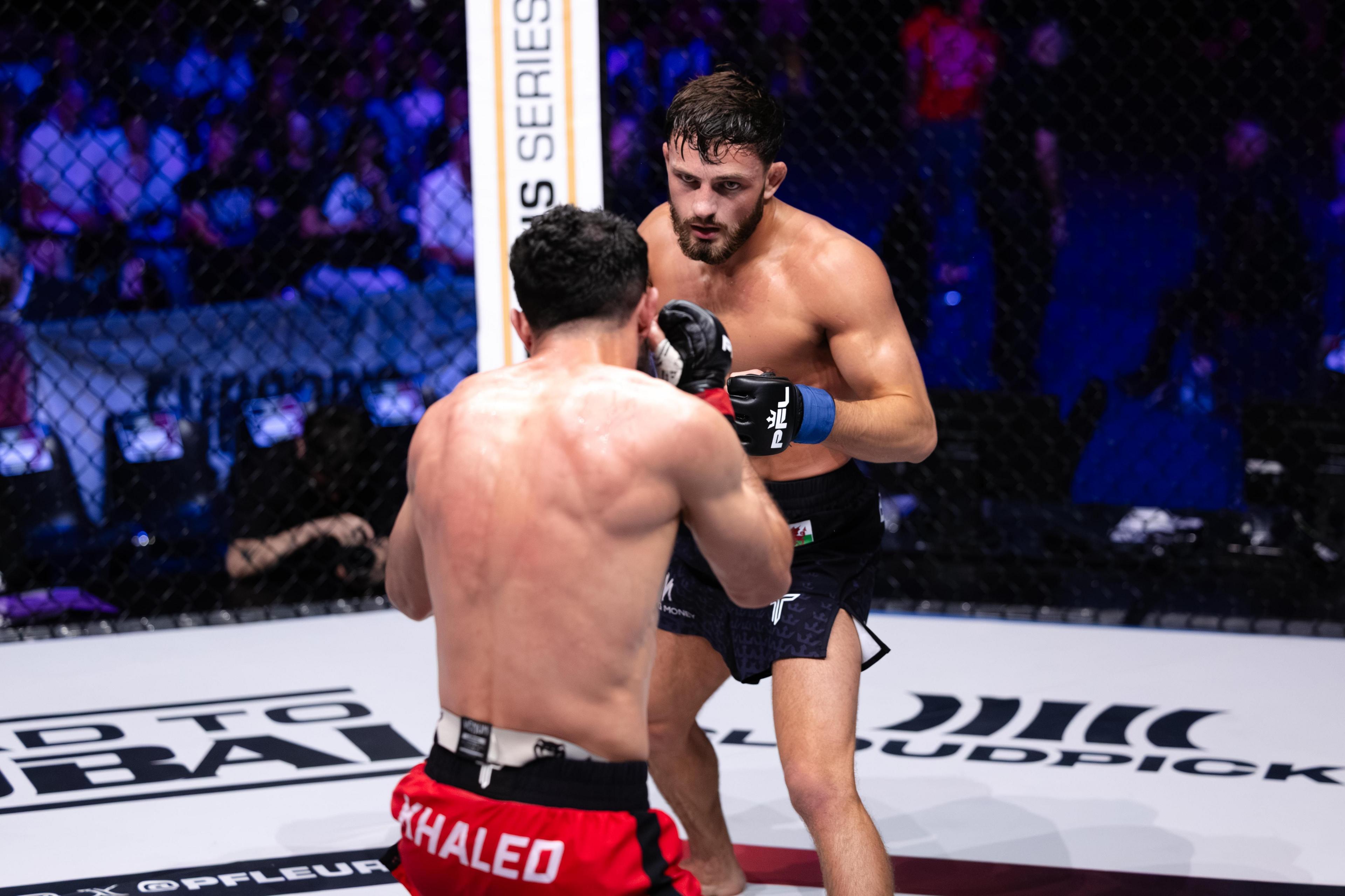 Levi Batchelor facing off against his opponent in the octagon 
