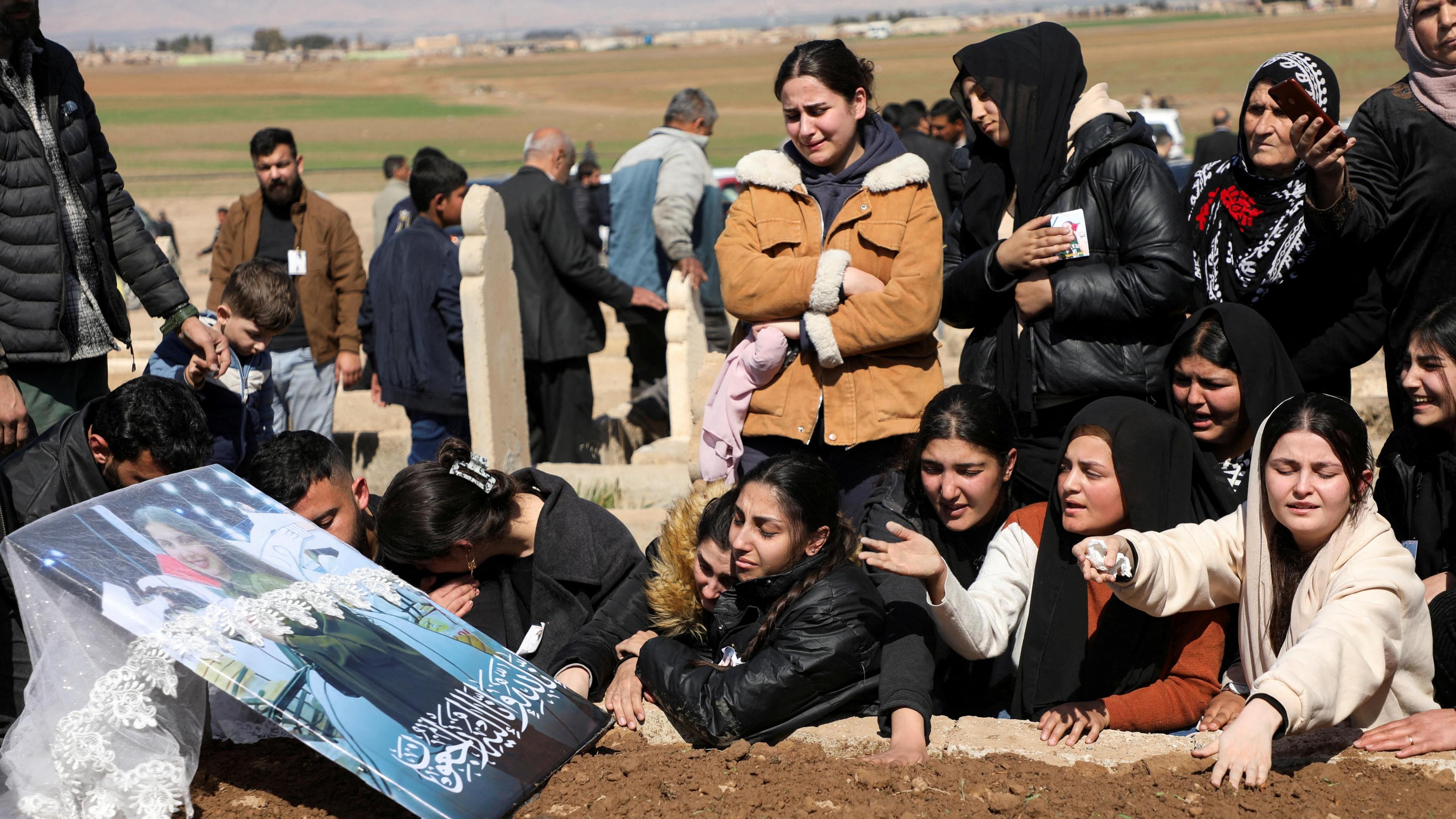 Mourners gather during the funeral of Shinda Kisho, who was killed in Latakia, in Qamishli, Syria (9 March 2025)