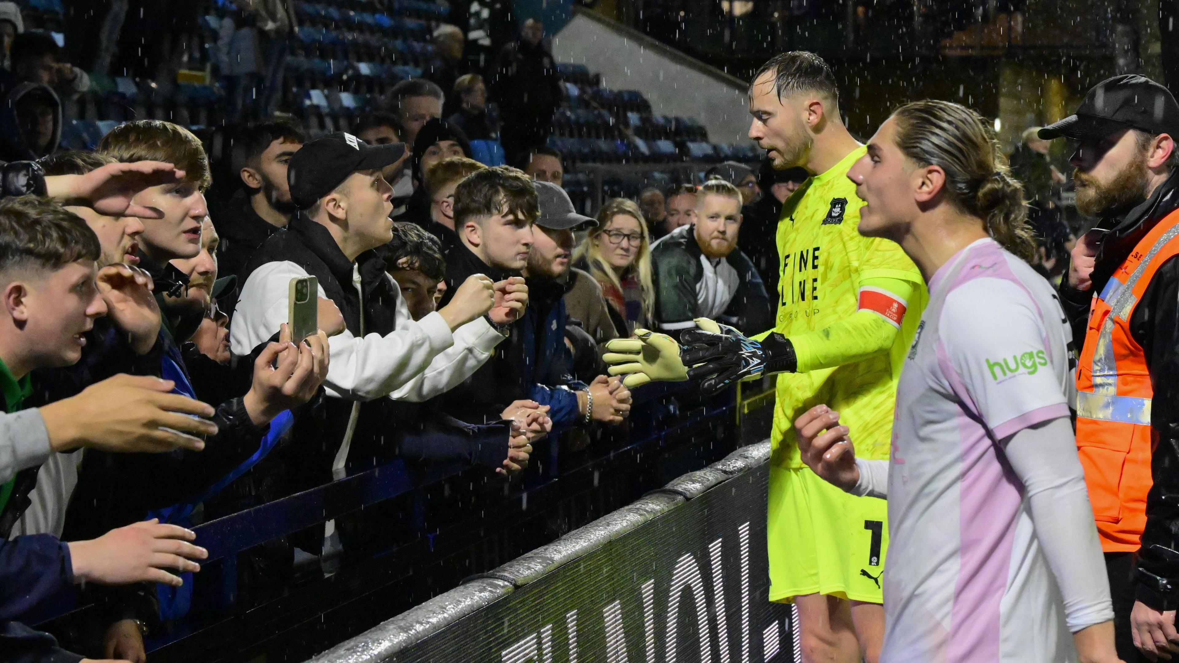 Goalkeeper Conor Hazard and striker Lorent Tolaj speak with Argyle fans after the 2-0 FA Cup loss at Wycombe last week