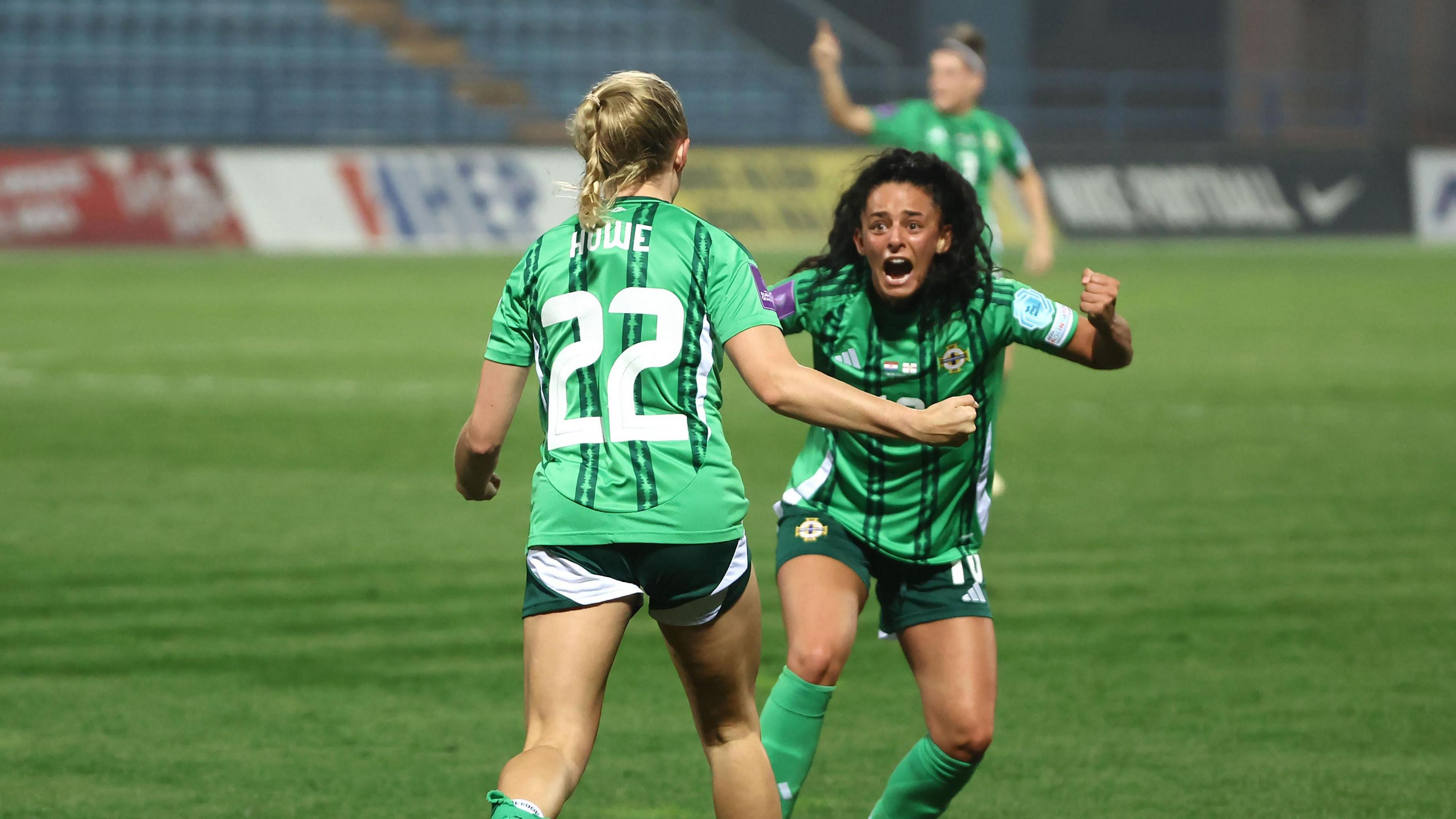 Casey Howe and Louise McDaniel celebrate Northern Ireland's goal