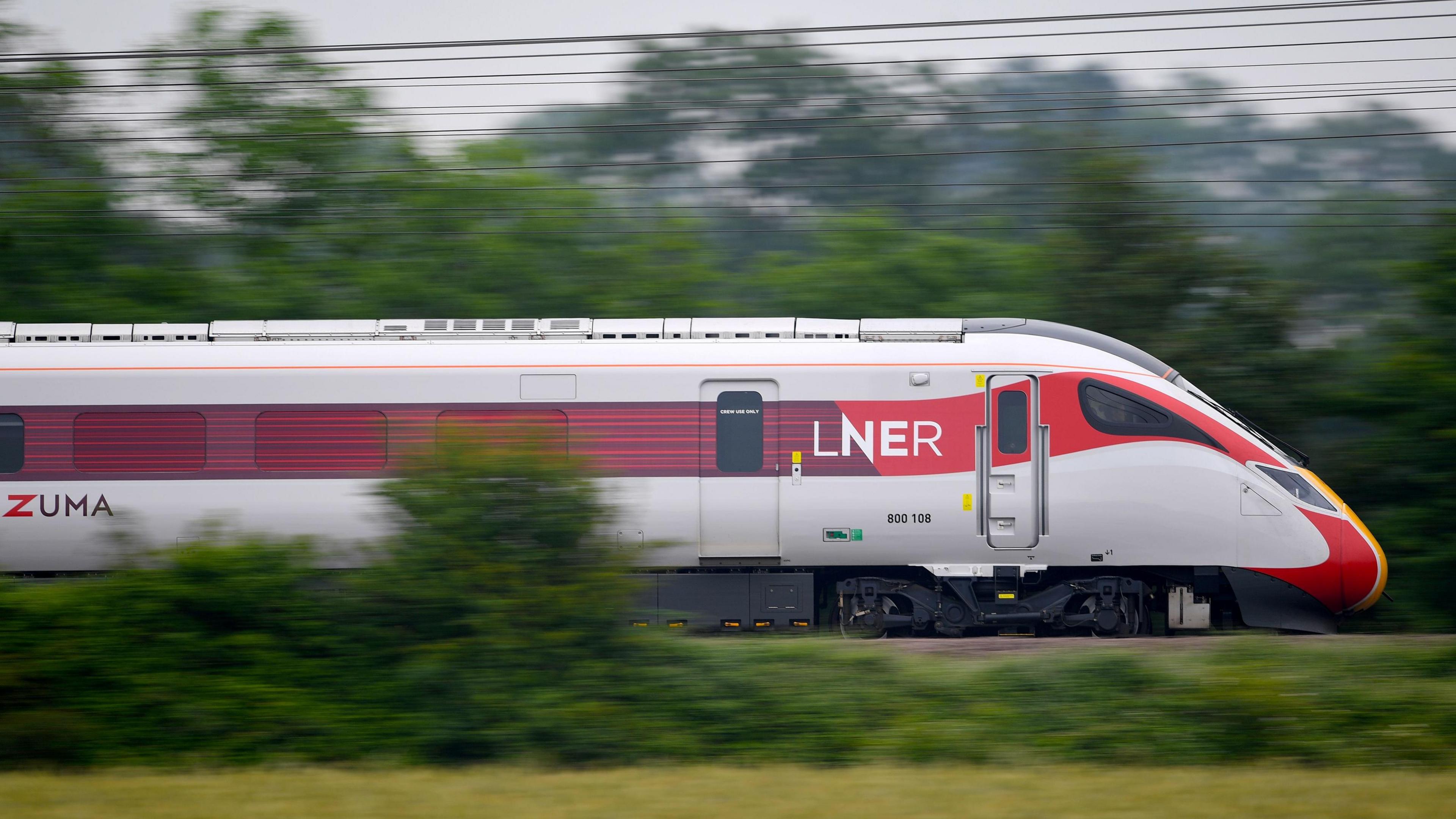 A stock image of a moving LNER training pictured on tracks in the countryside