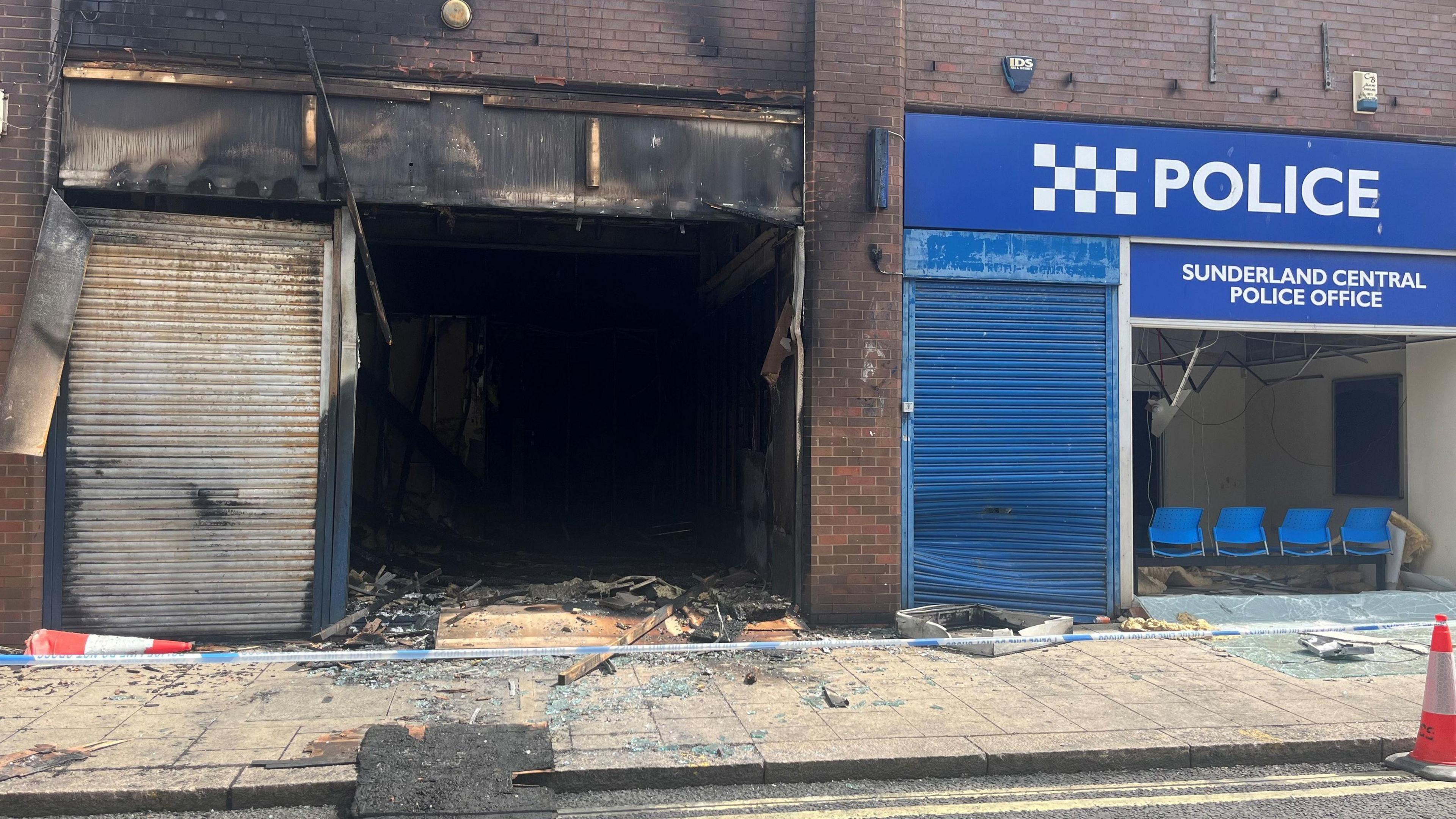 A burnt out shell of a building.