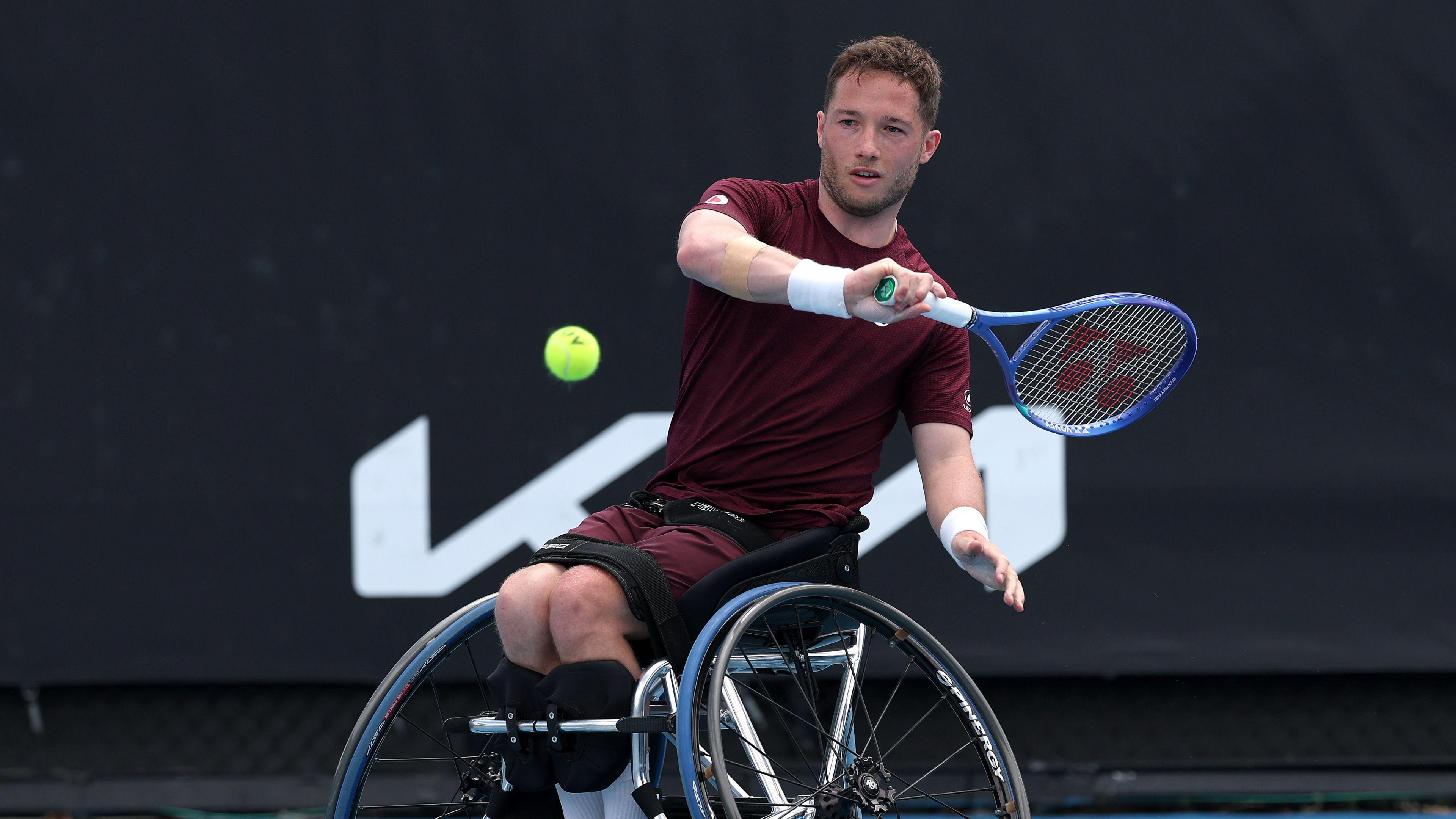 Alfie Hewett hits the ball