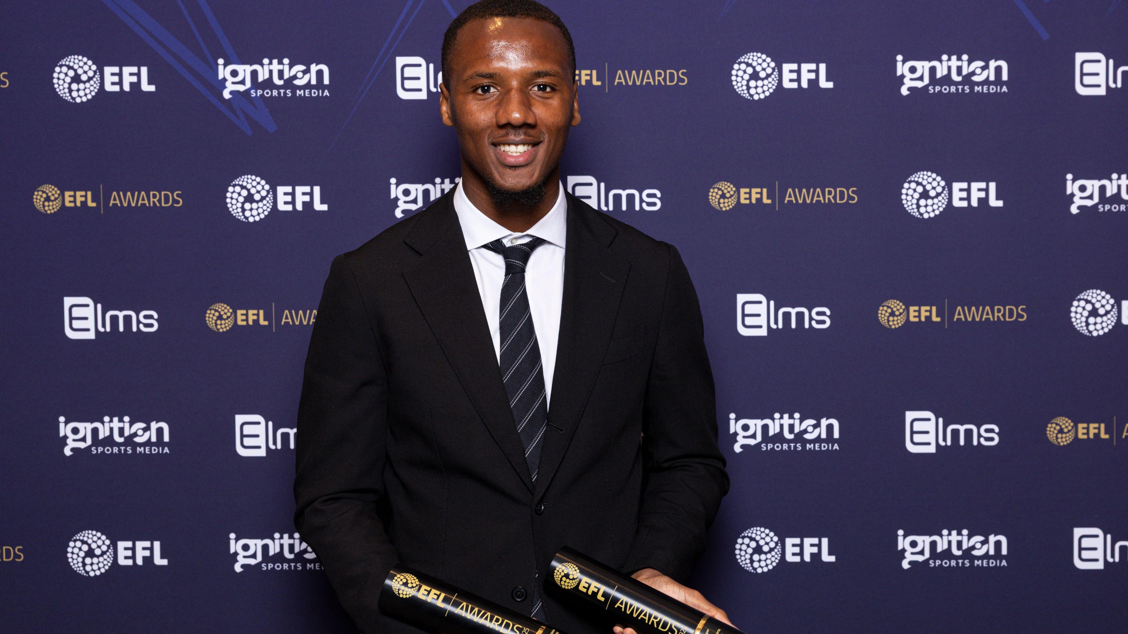 Wycombe's Richard Kone with his awards for winning the League One's player and young player of the season