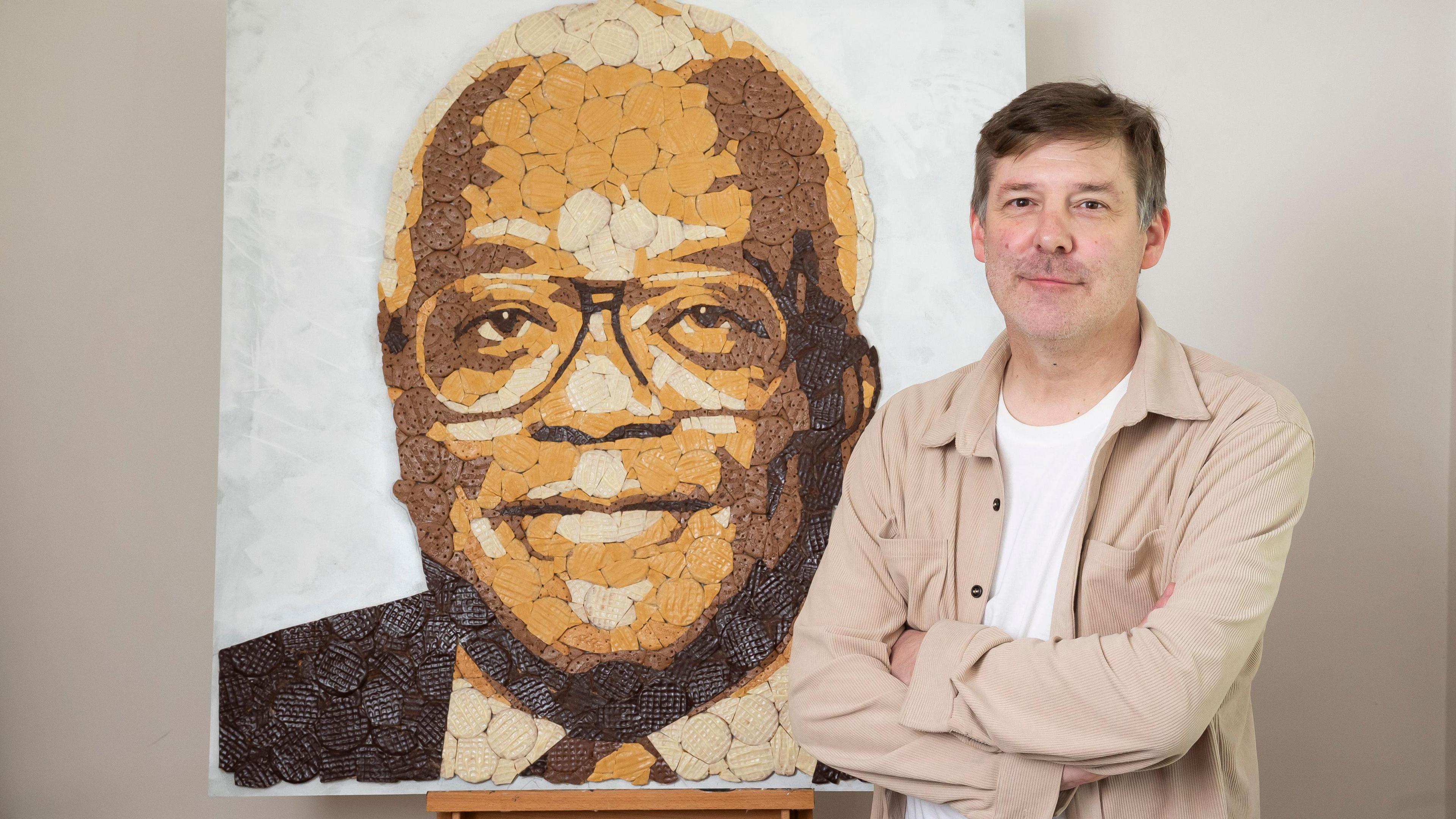 The artist, Ed Chapman, with the Trevor McDonald portrait