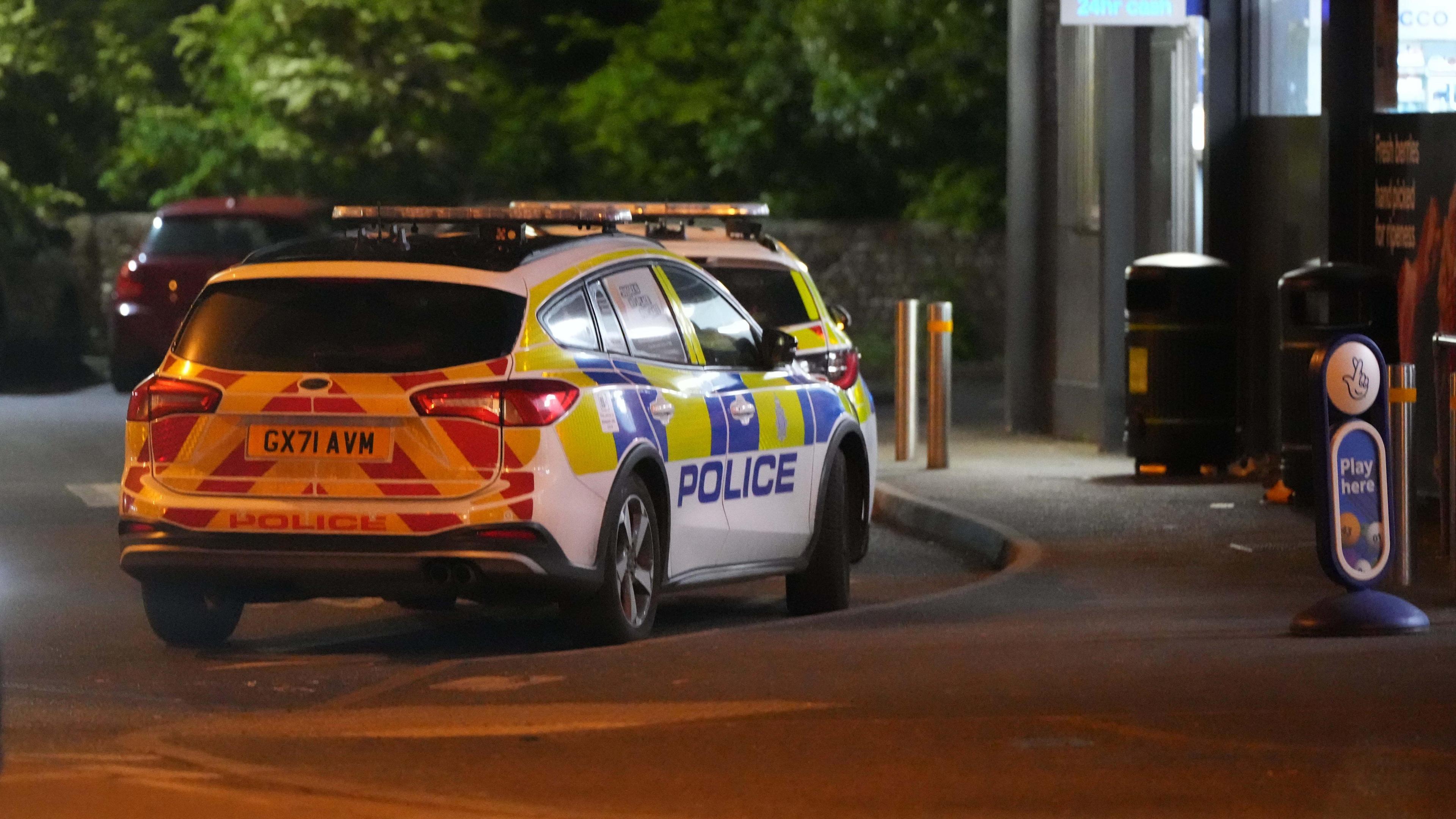 Police cars outside Southdowns pub in Bognor Regis at night time