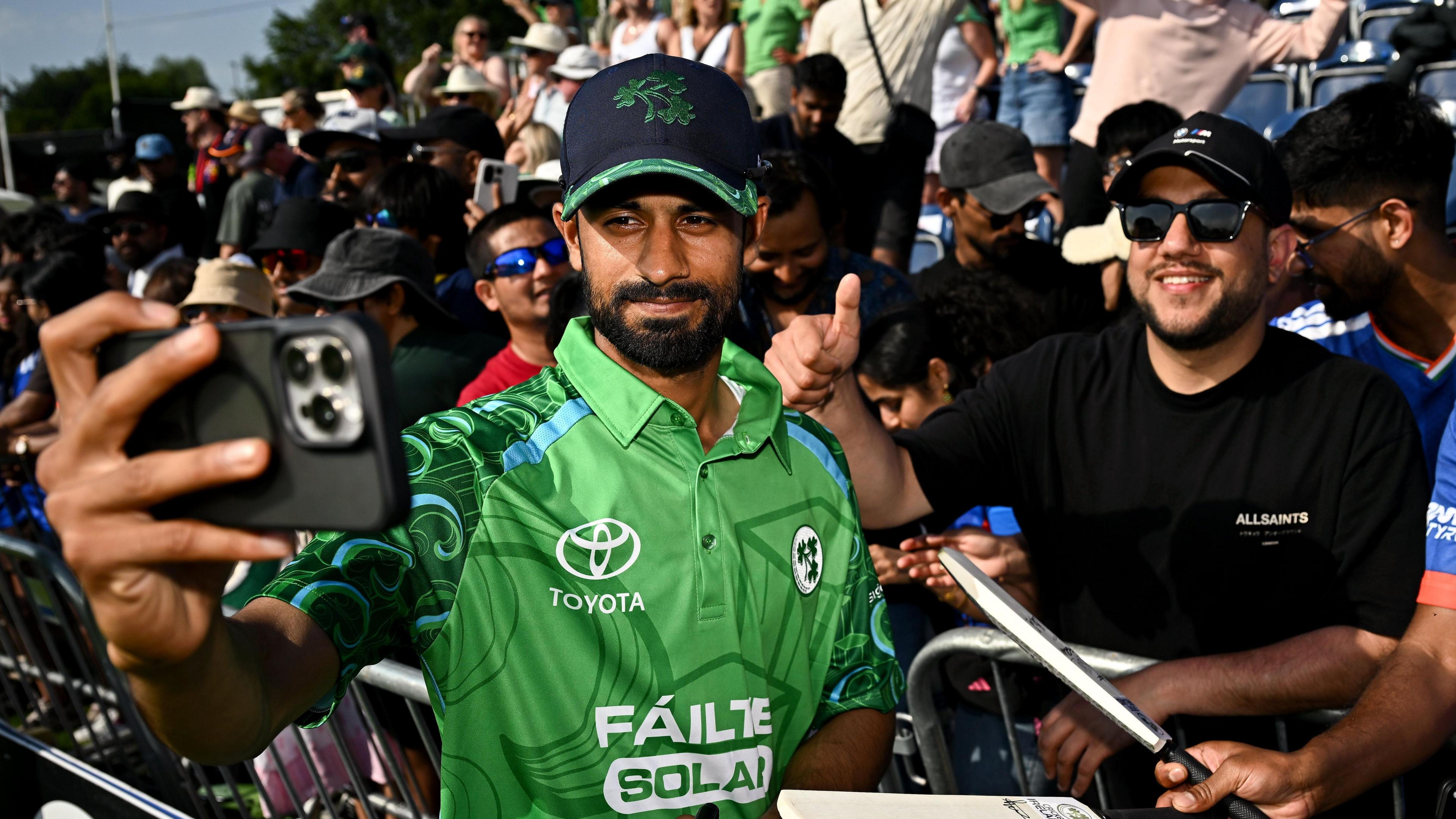 Jai Moondra poses for a selfie with a fan