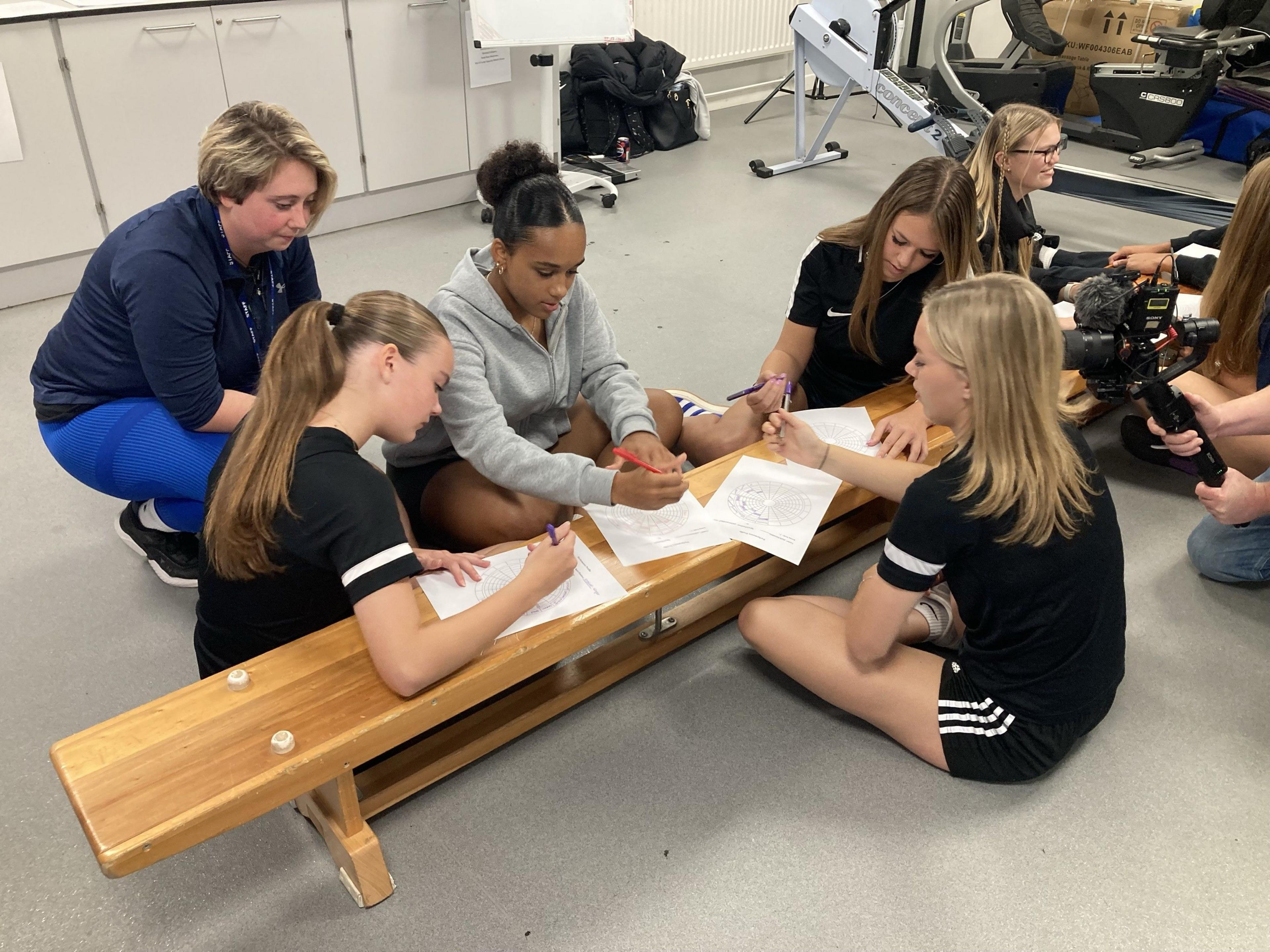 Players from Cambridge City Women FC during a school lesson at Long Road Sixth Form College