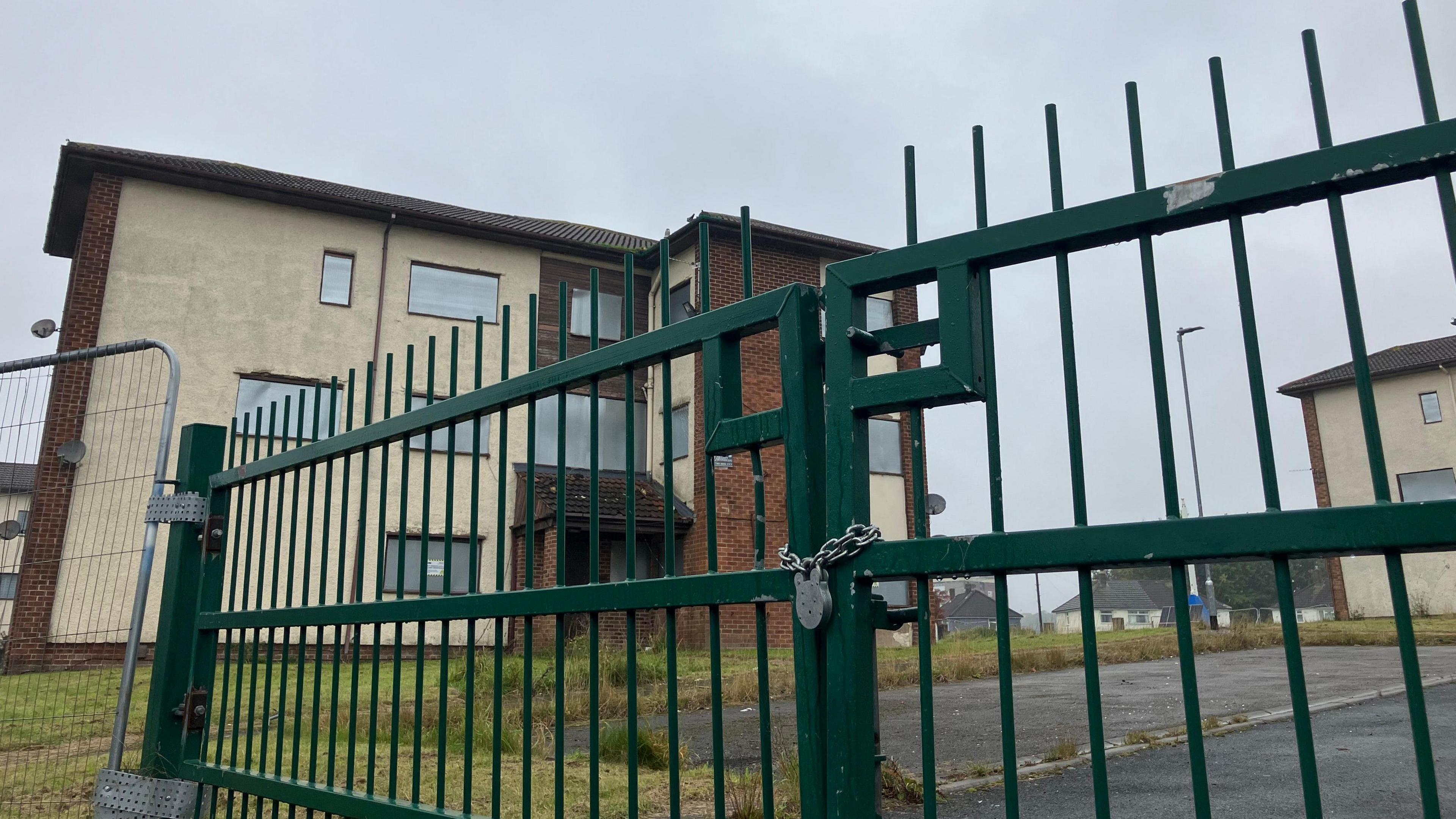 A padlocked gate at the entrance to Kingsdale Court in Seacroft