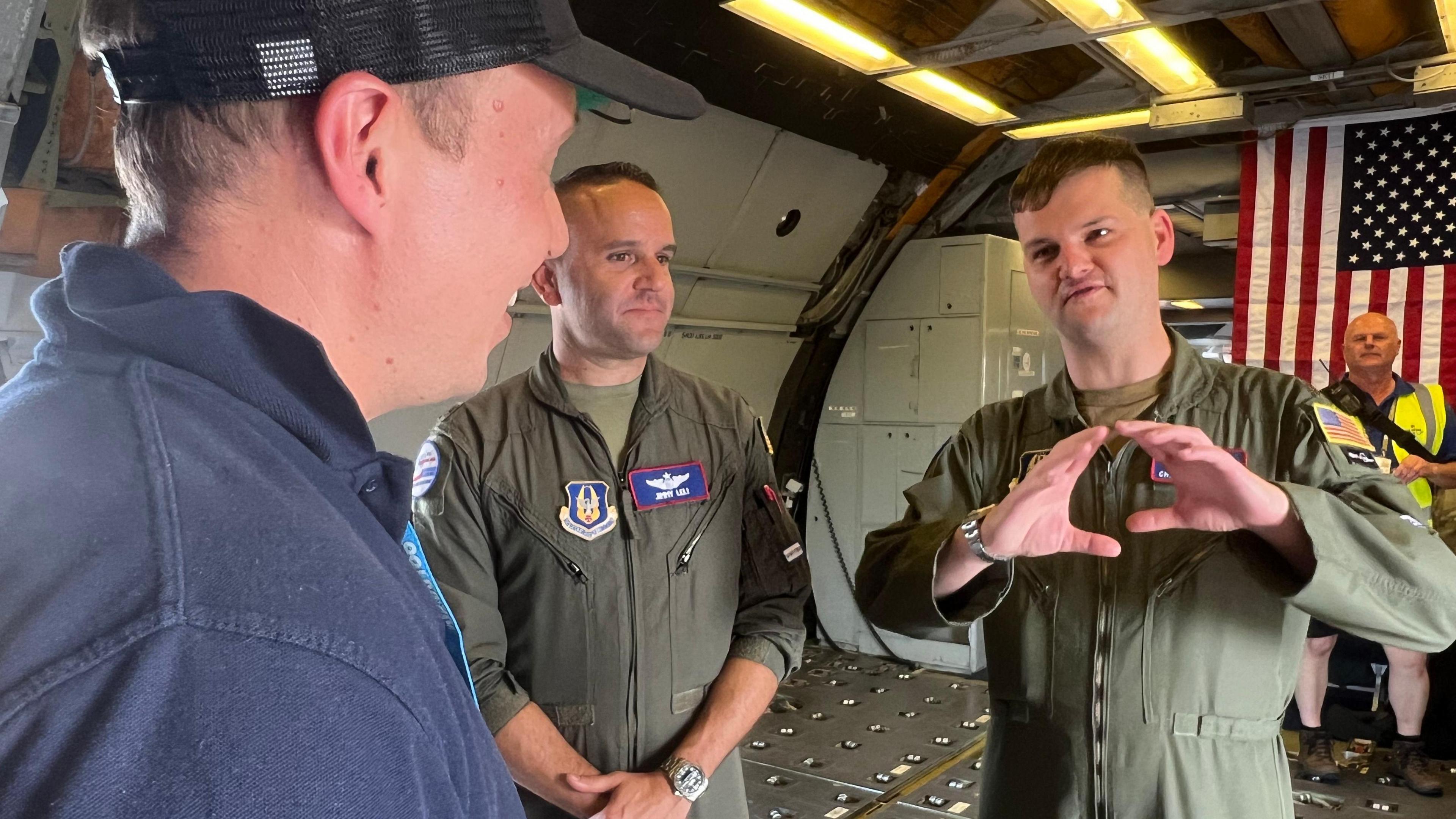 Major Christian Rotter, speaking with Charlie Walker, Night Fright pilot and owner.