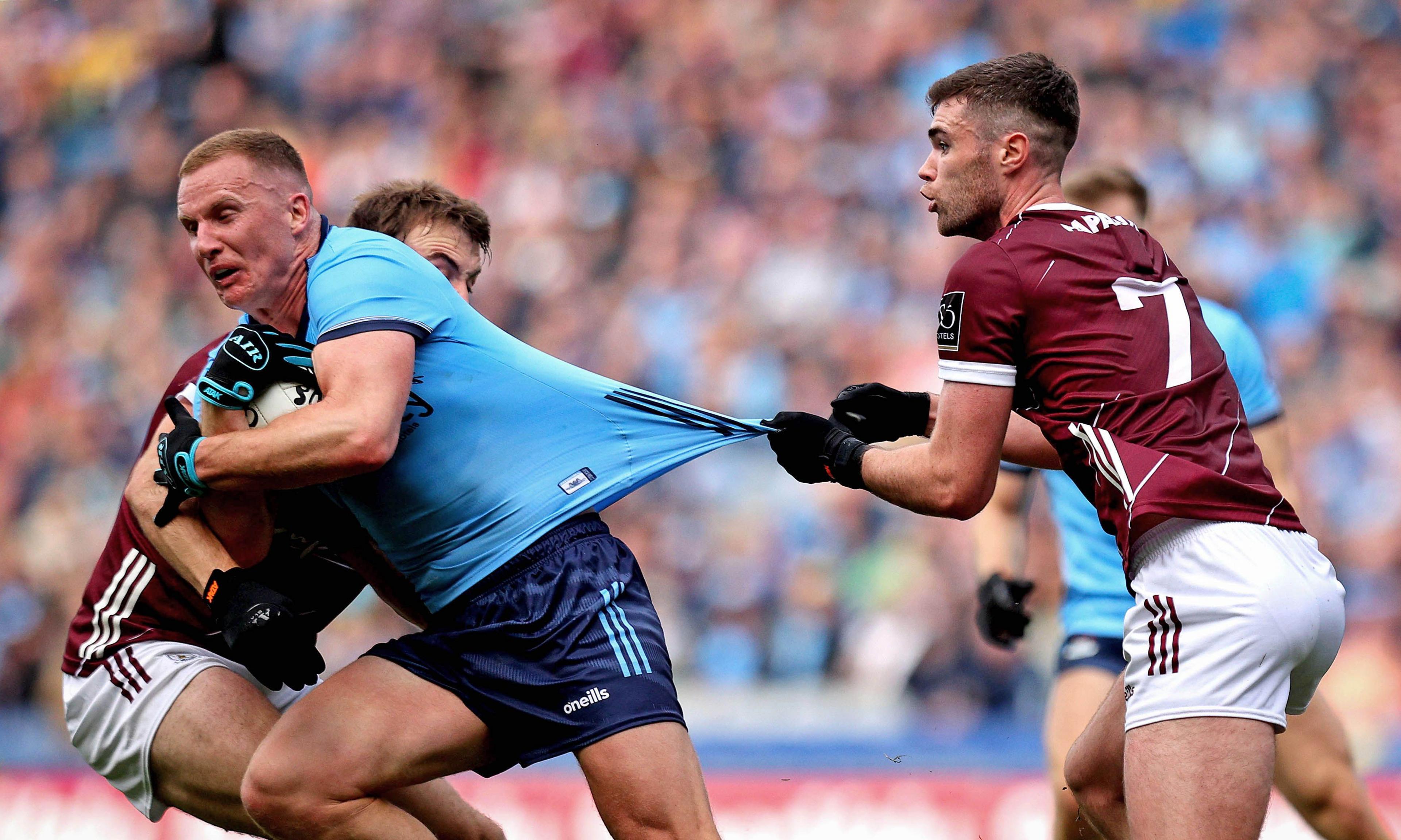 Ciaran Kilkenny tries to break through Galway tackles