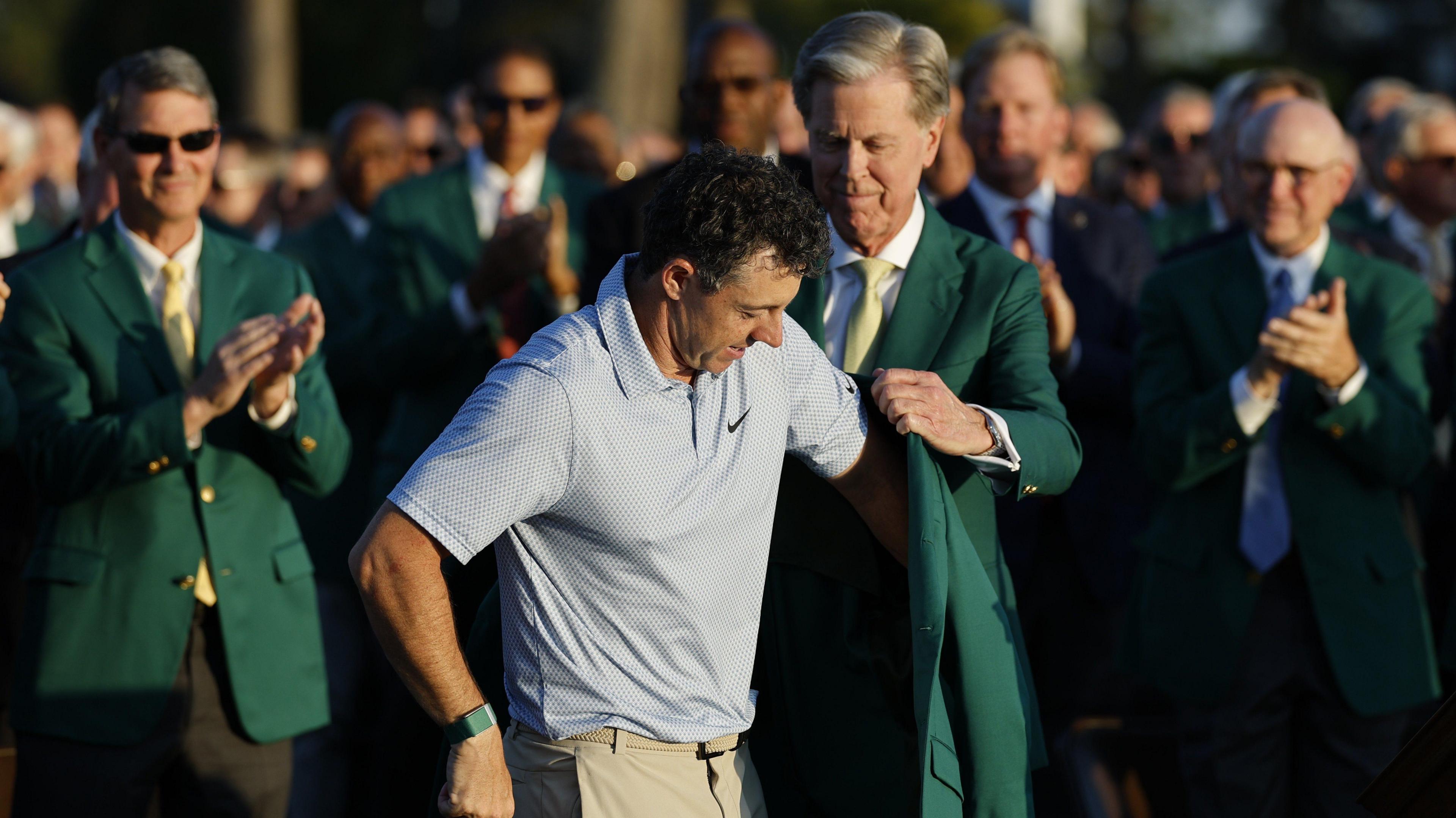 Fred Ripley, chairman of Augusta National Golf Club, awards Rory McIlroy of Northern Ireland with the Green Jacket during the Green Jacket Ceremony after the final round of the 2026 Masters tournament in Augusta, Georgia, USA. 