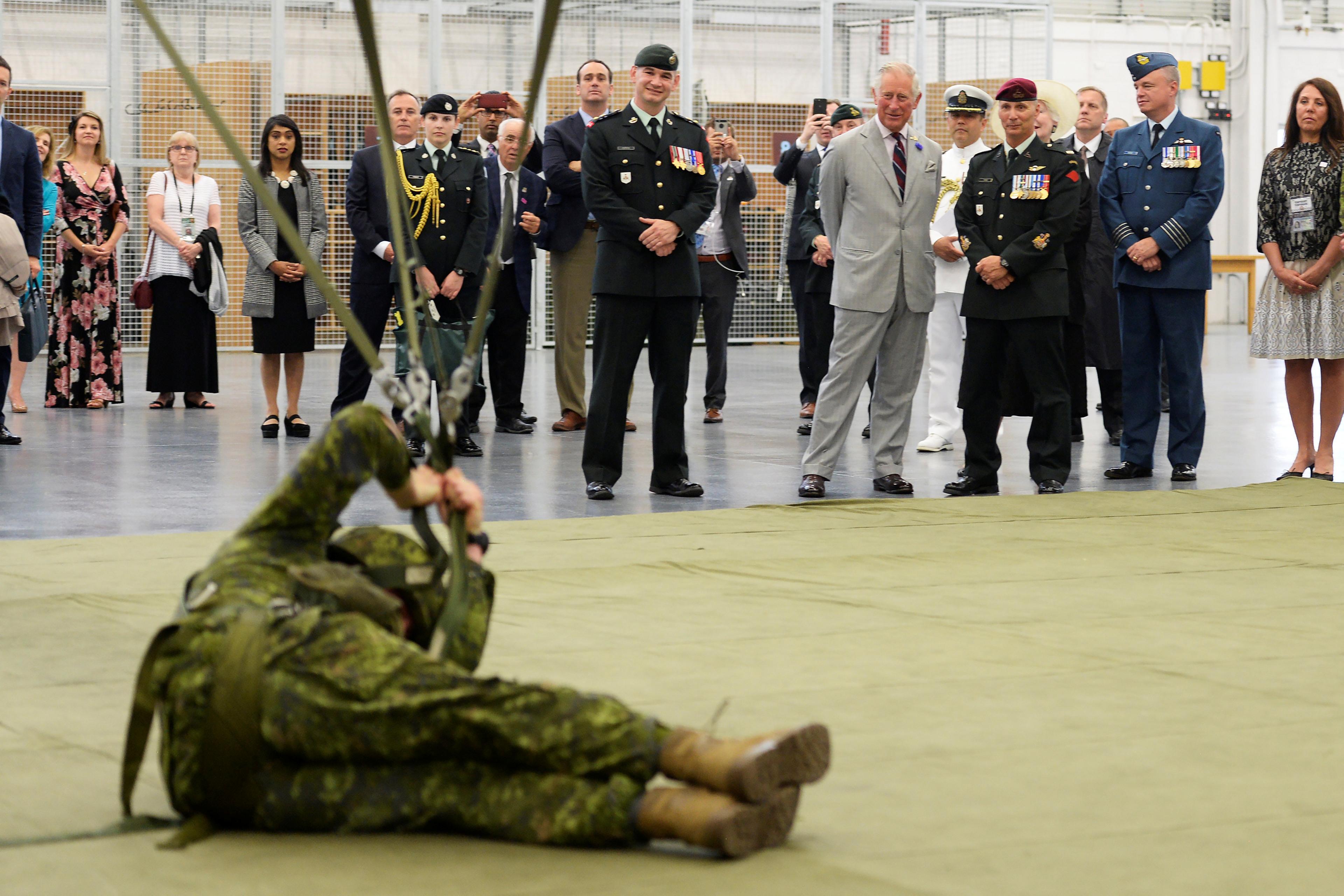 The military show Charles a mock search and rescue operation