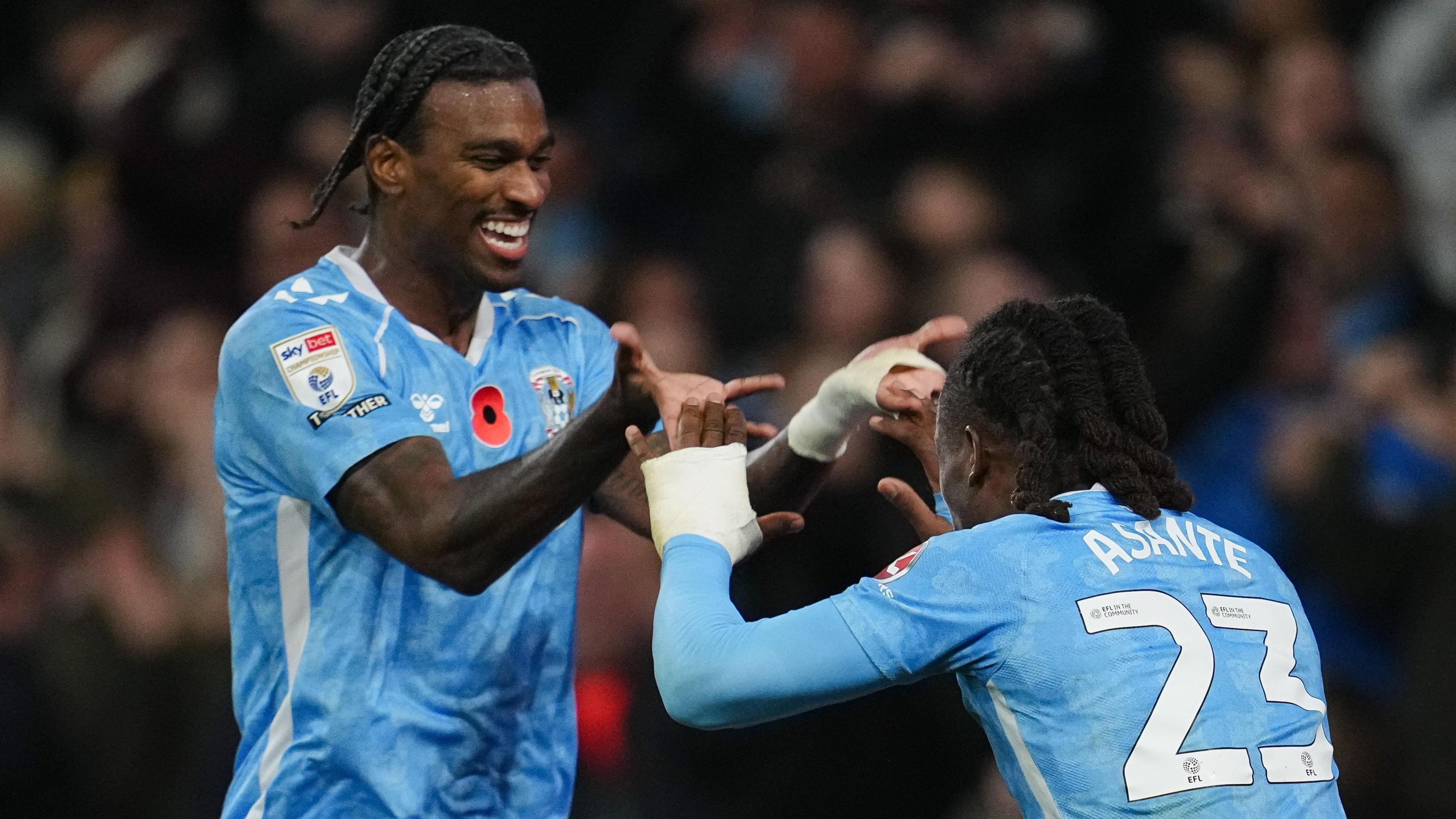 Haji Wright celebrates a goal with Brandon Thomas-Asante