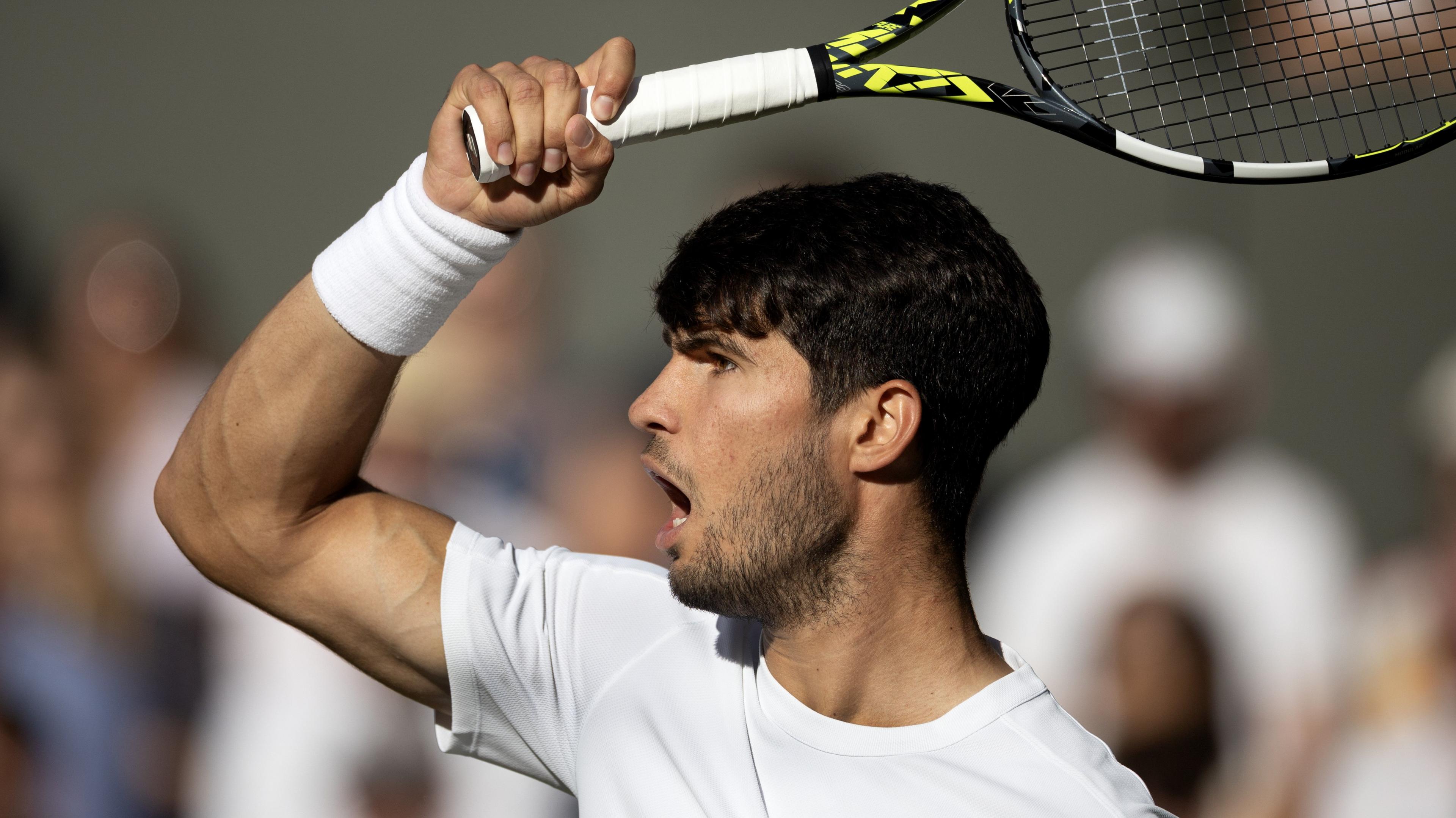 Carlos Alcaraz hits a forehand during his Wimbledon quarter-final win against Cameron Norrie