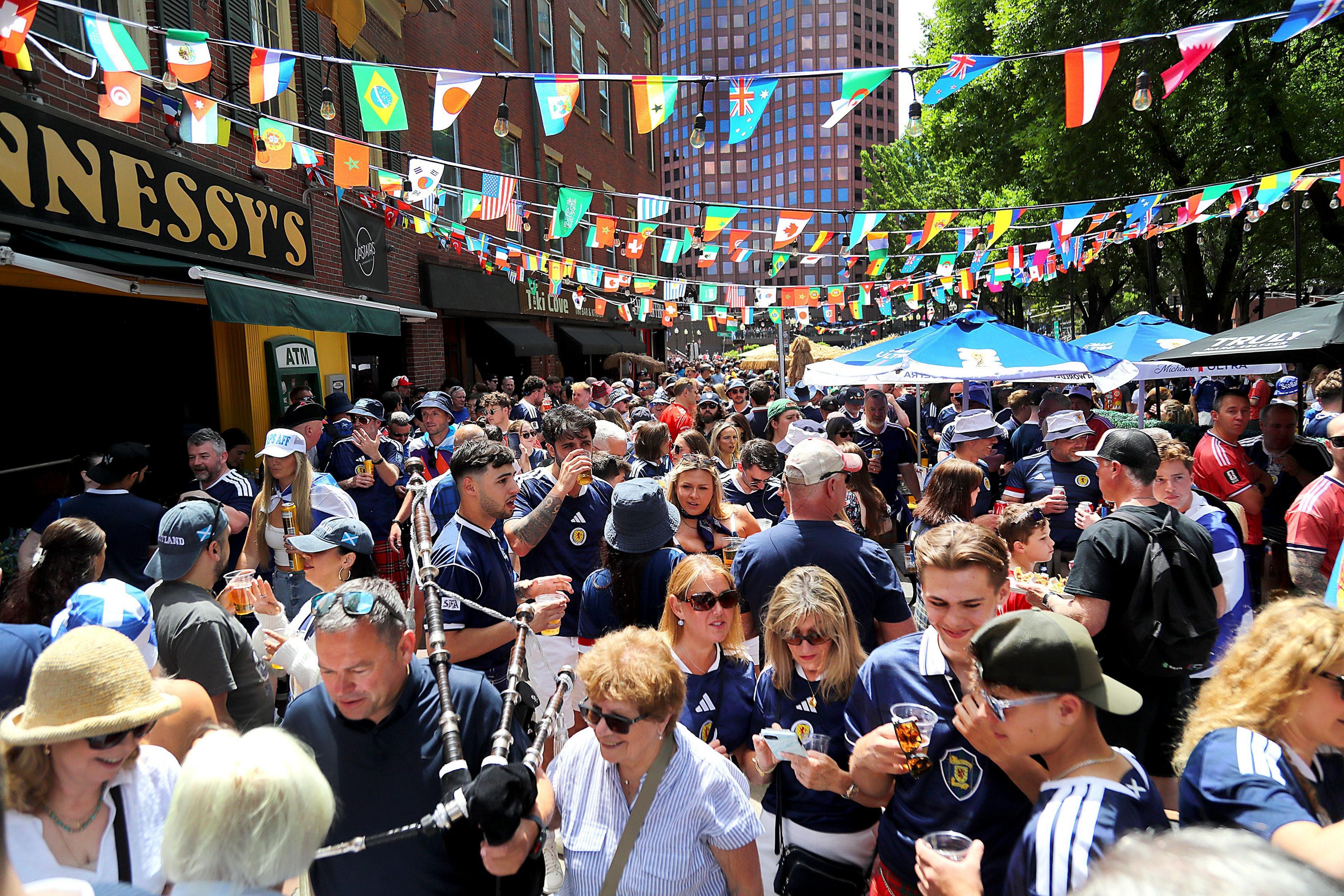 Scotland football fans congregate outside of Hennessy's Bar in Boston on the day of the Morocco match
